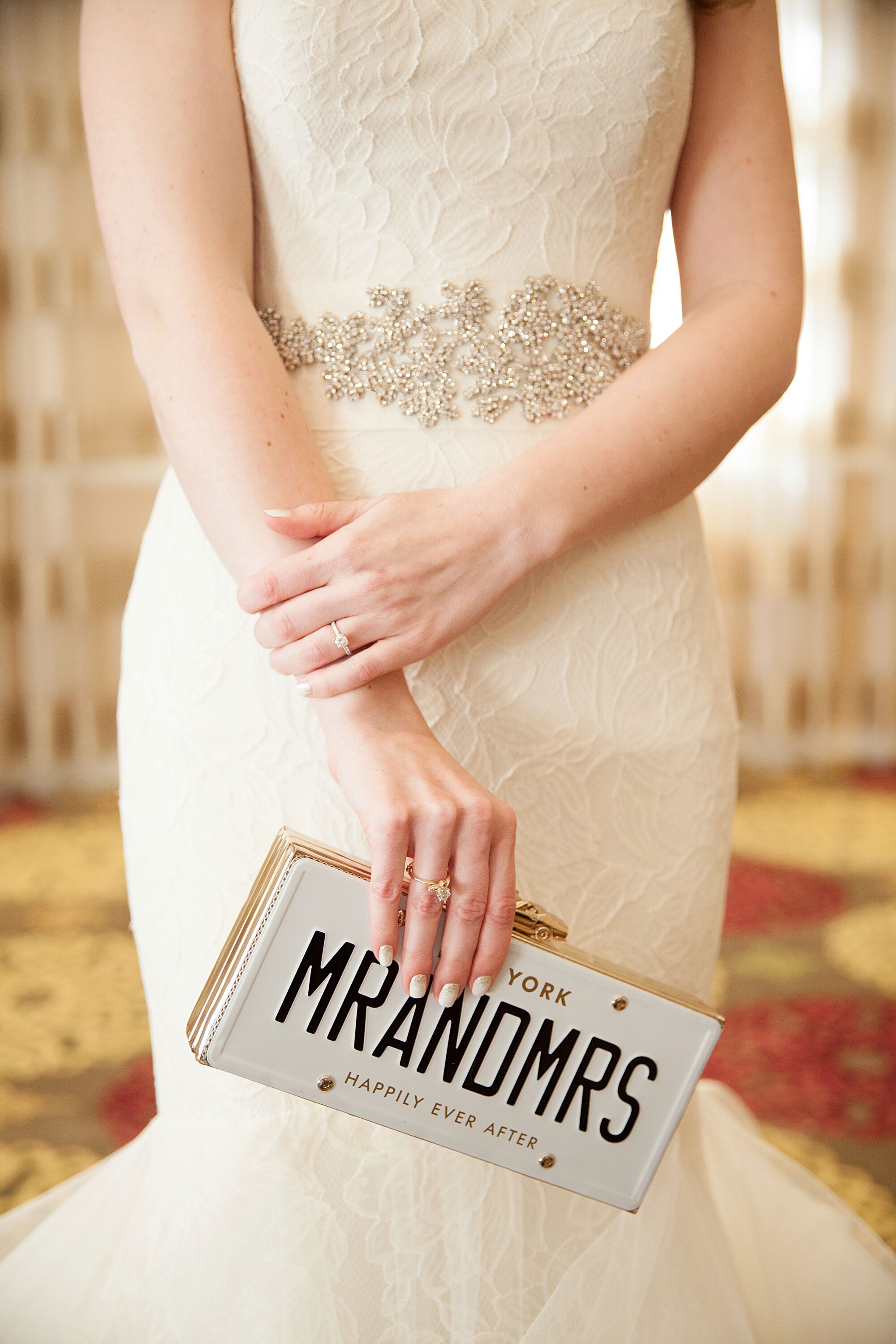 Bride in a Beaded Belt and a Kate Spade Clutch