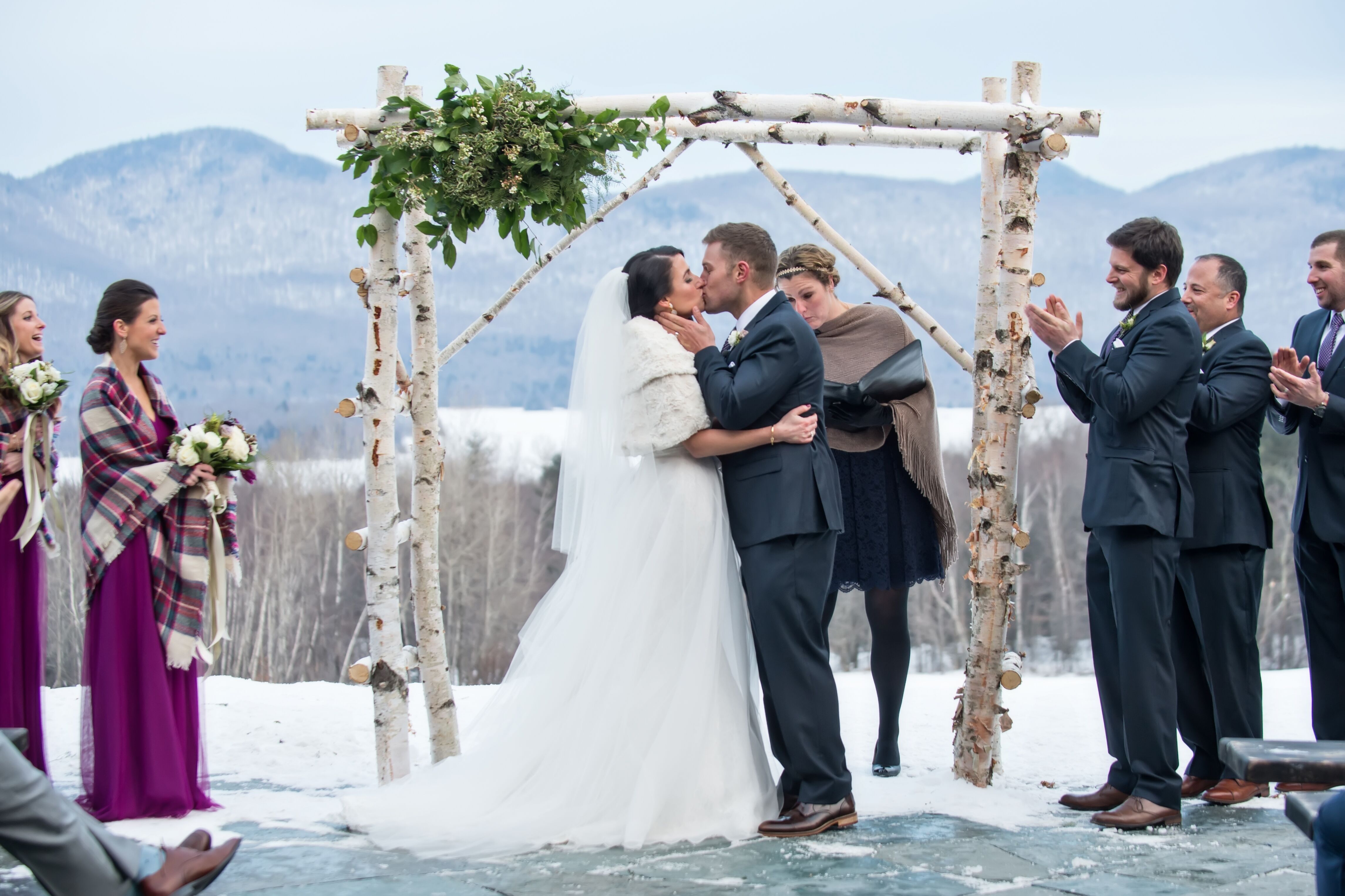 Snowy Winter Wedding Ceremony Under Birch Arch