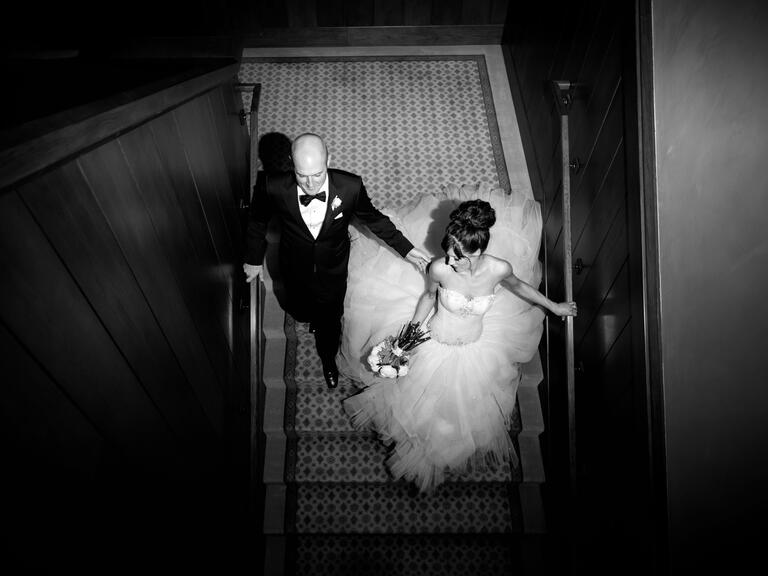 Overhead black and white wedding photography of bride and groom