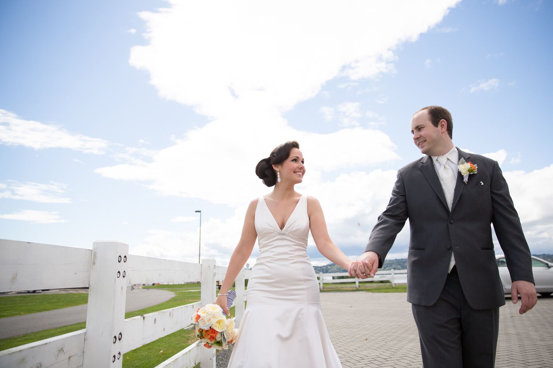 Bride and Groom Holding Hands Outside