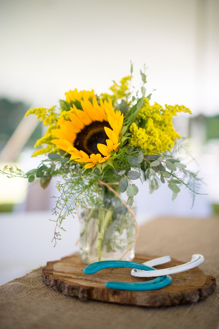 Centerpieces of Sunflowers in Mason Jars on Wood Slabs