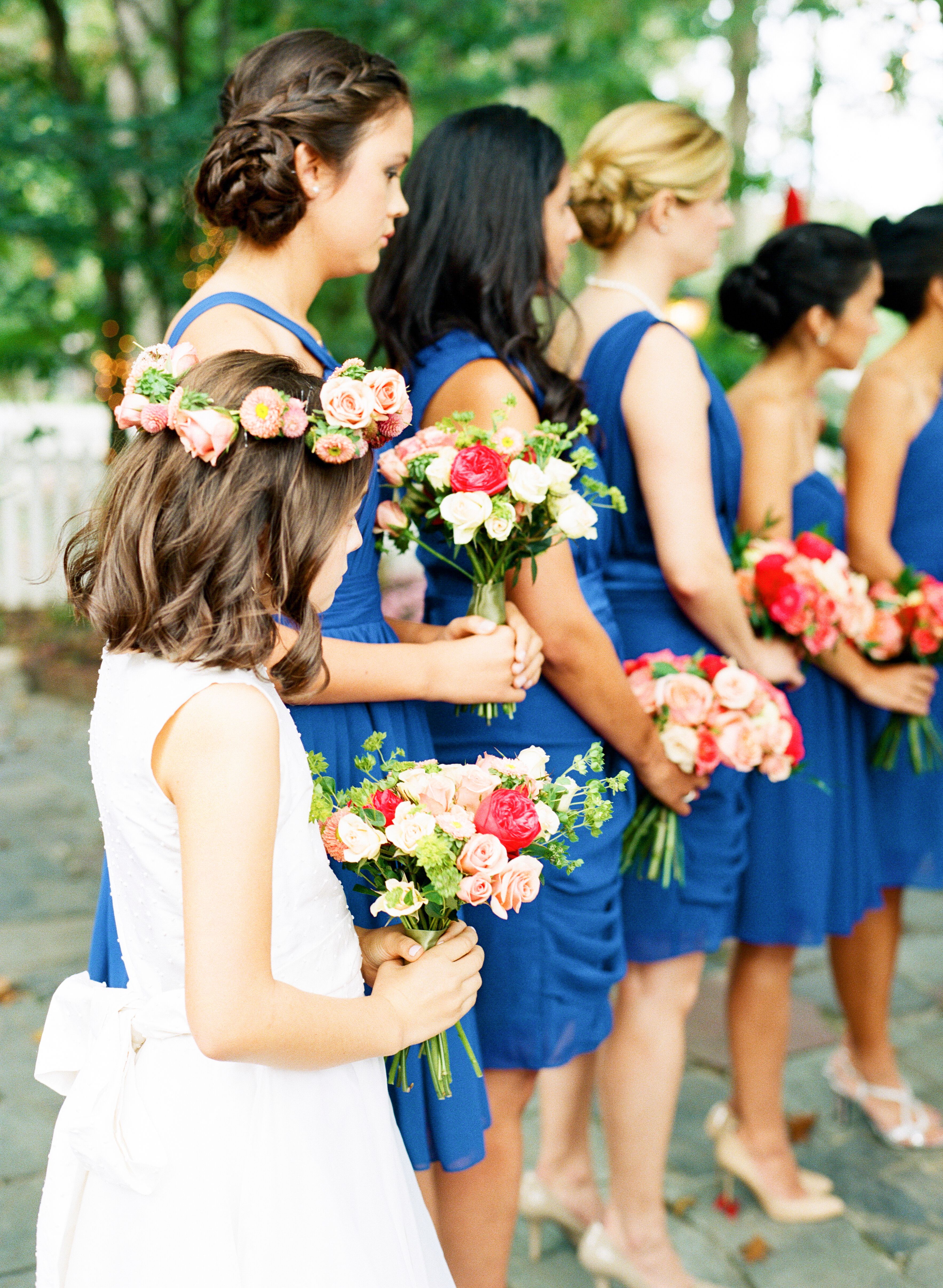 Bridesmaids in Navy Blue Dresses Bouquets of Pink and Blush Roses