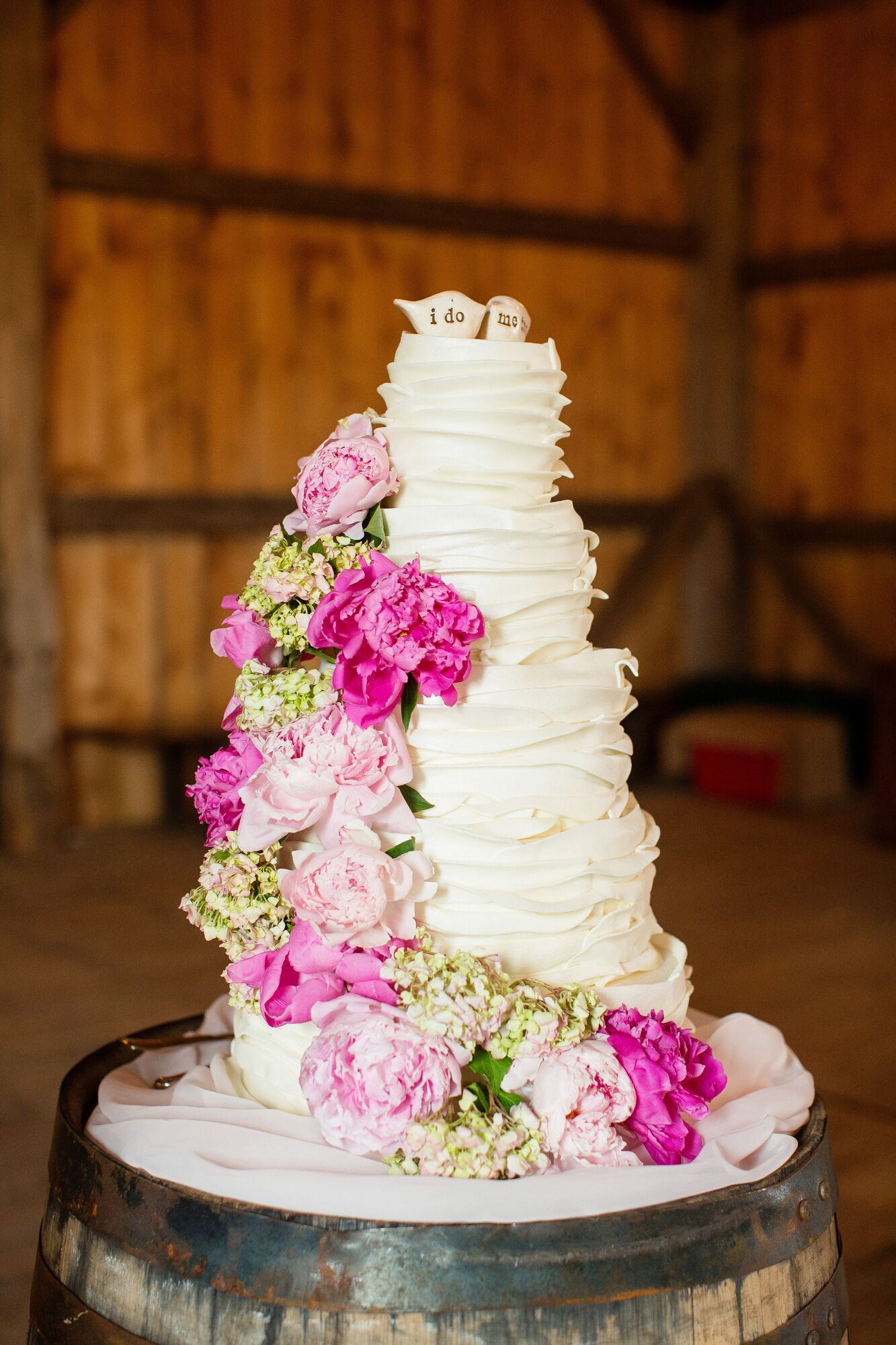 A Ruffled Wedding  Cake  with Pink Peonies 
