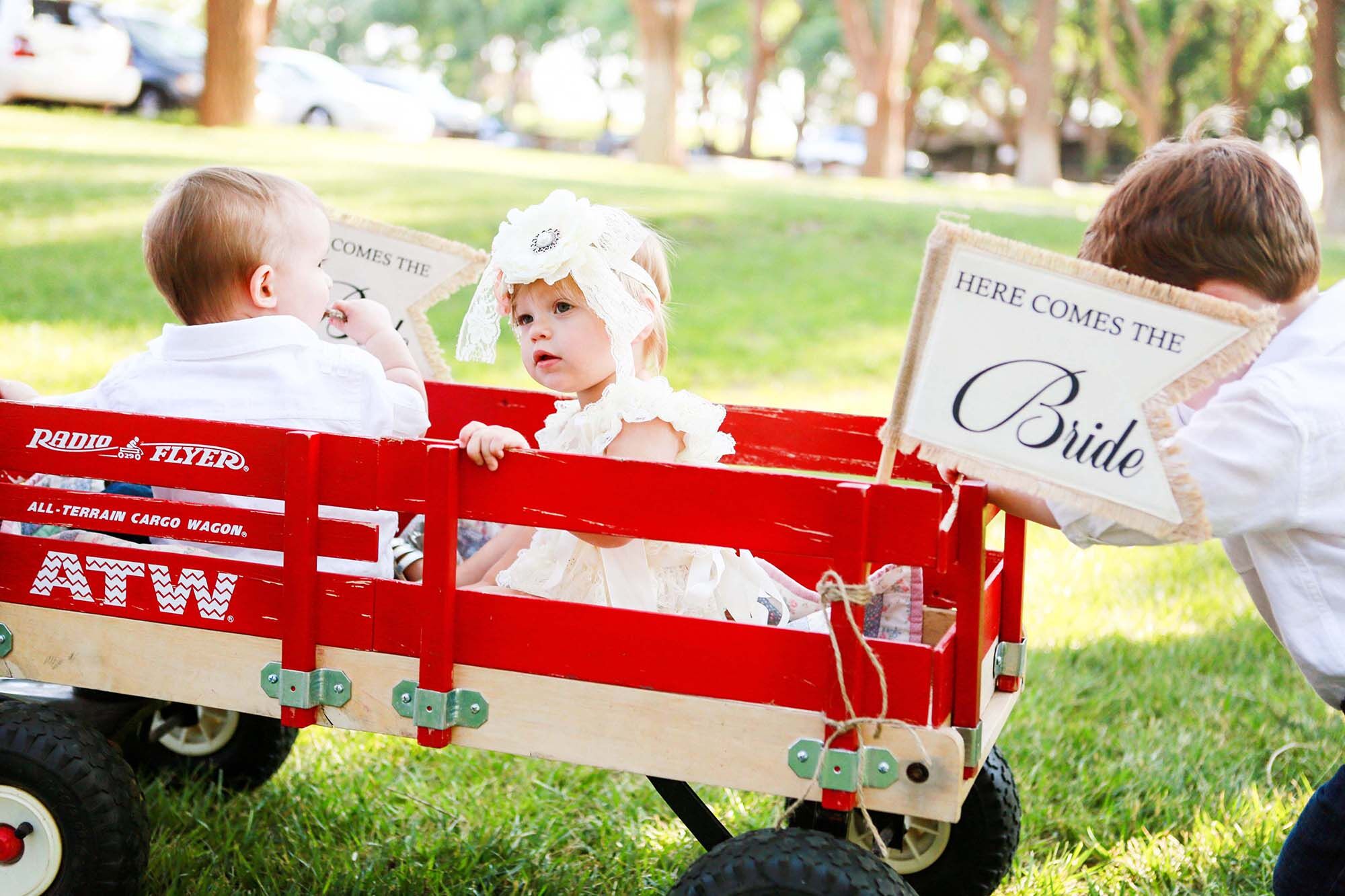 Flower Girl and Ring Bearers in Wagon