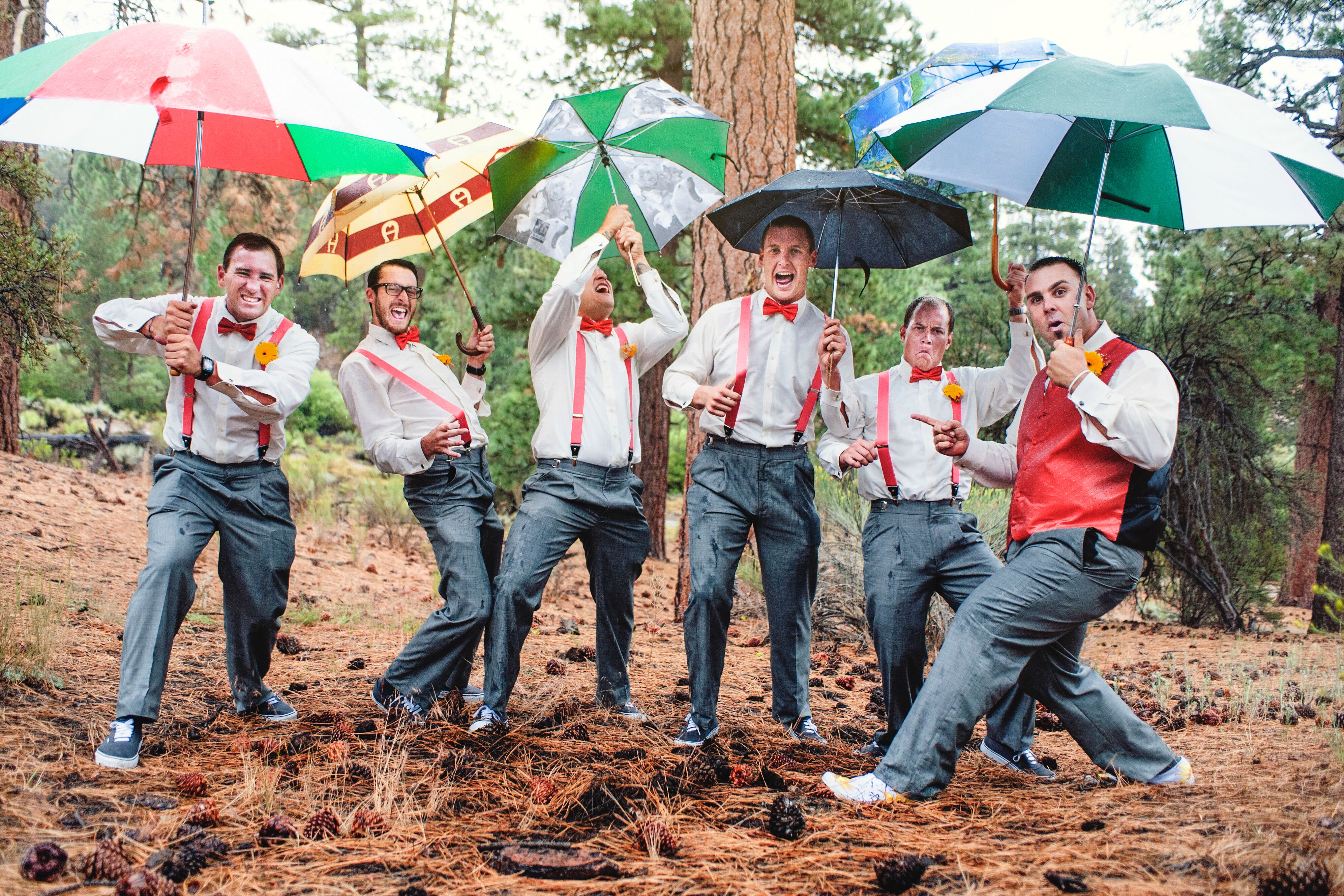 groomsmen in jeans and suspenders