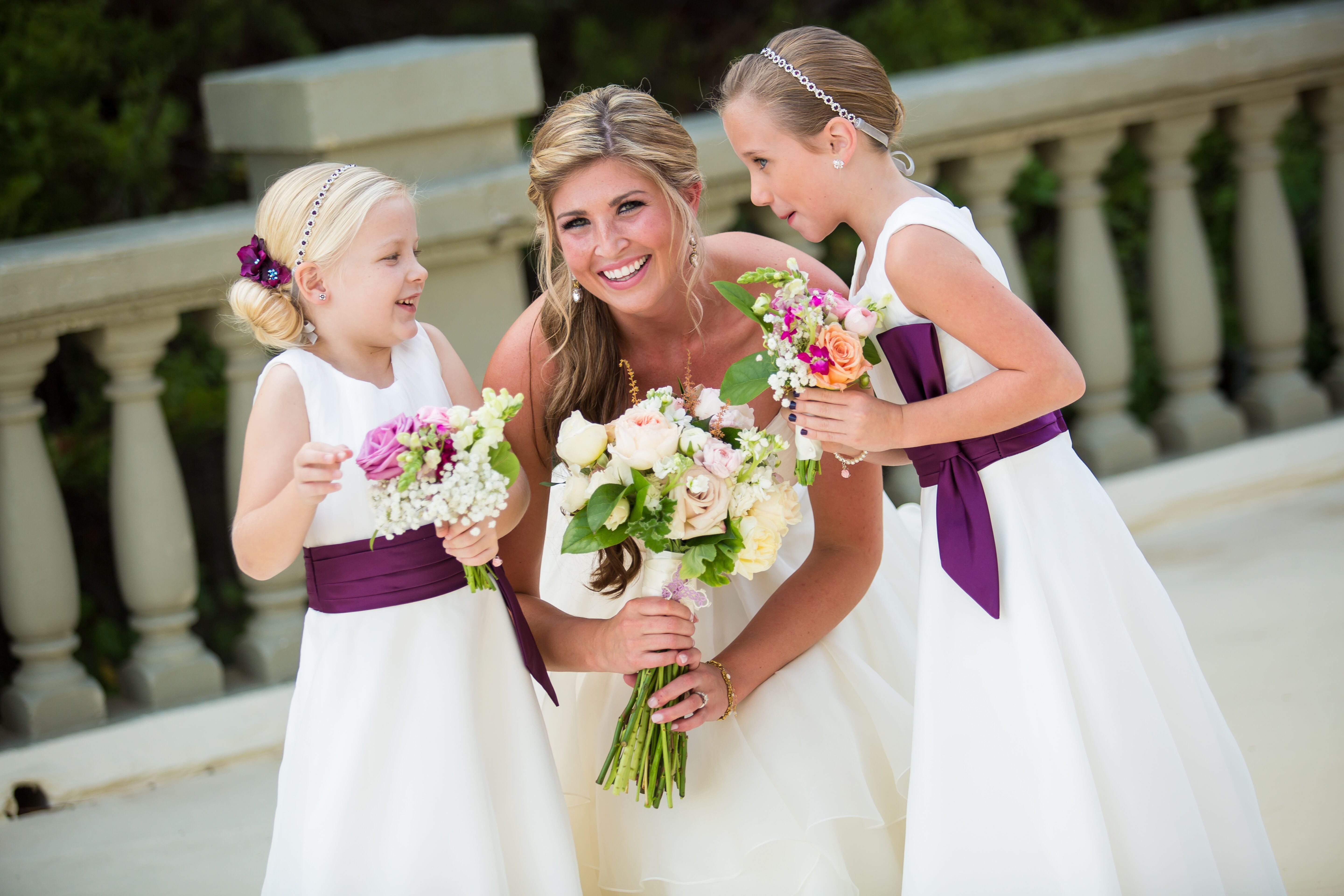 white flower girl dress with purple sash