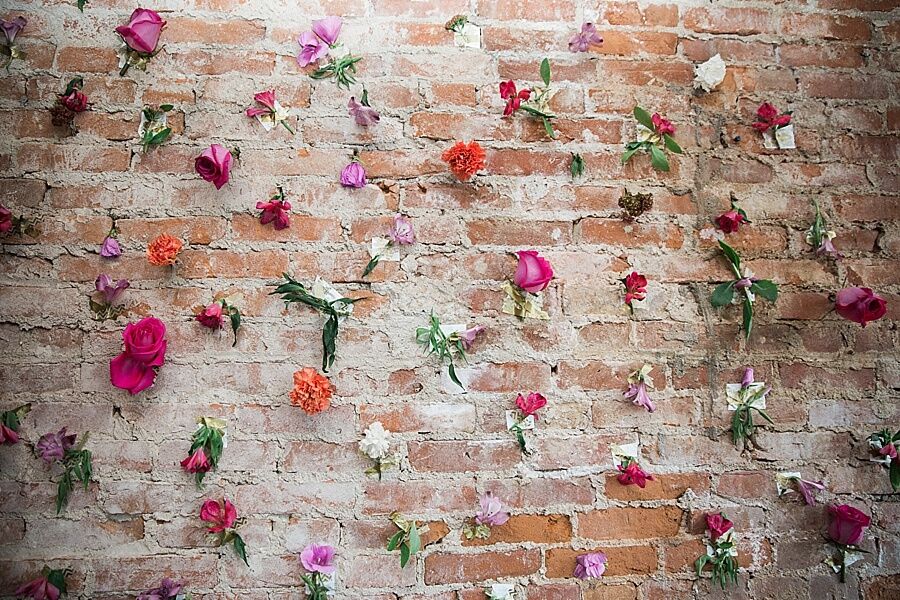 Brick-Wall Backdrop Decorated With Flowers