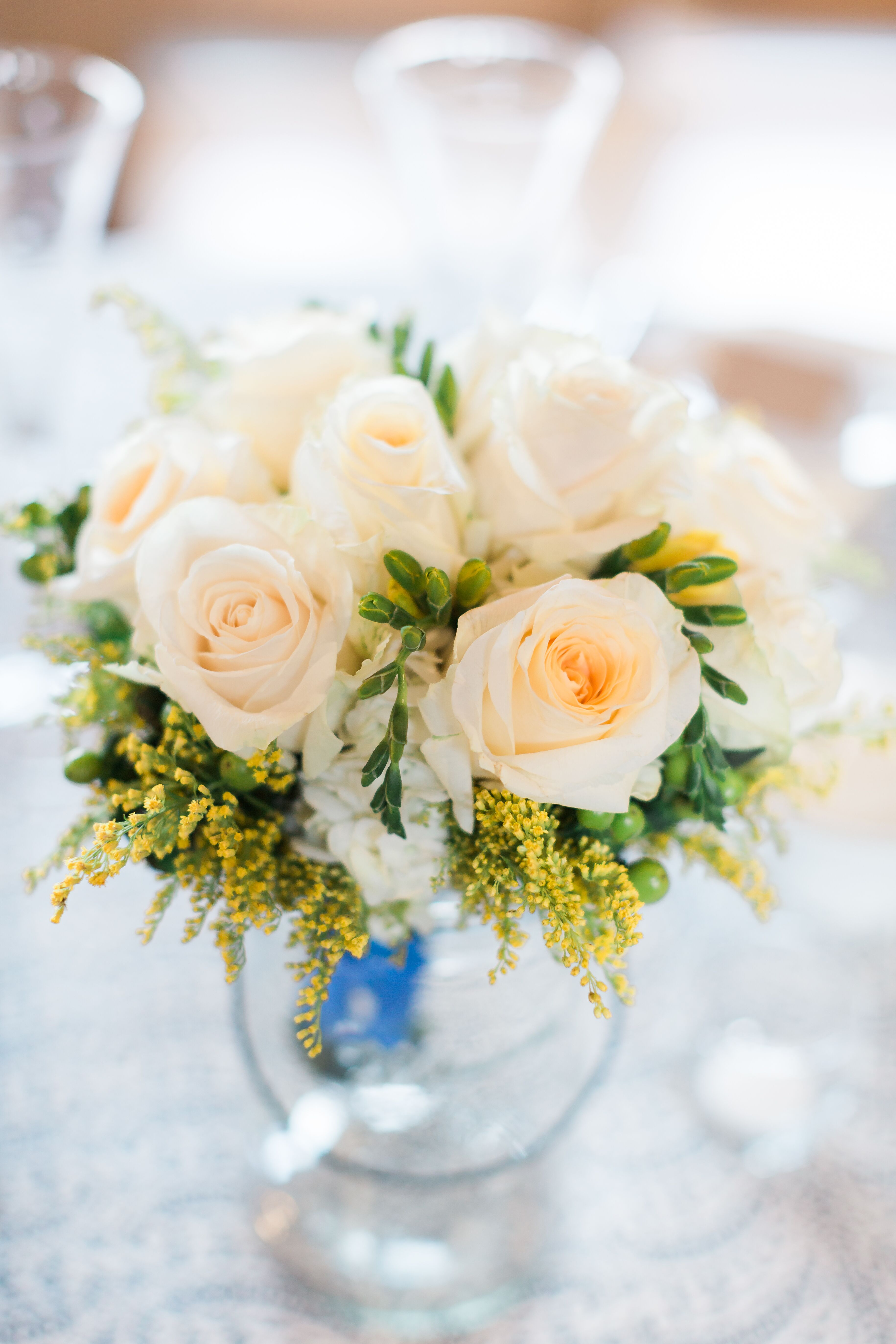 White Rose Centerpiece in Globe Vase