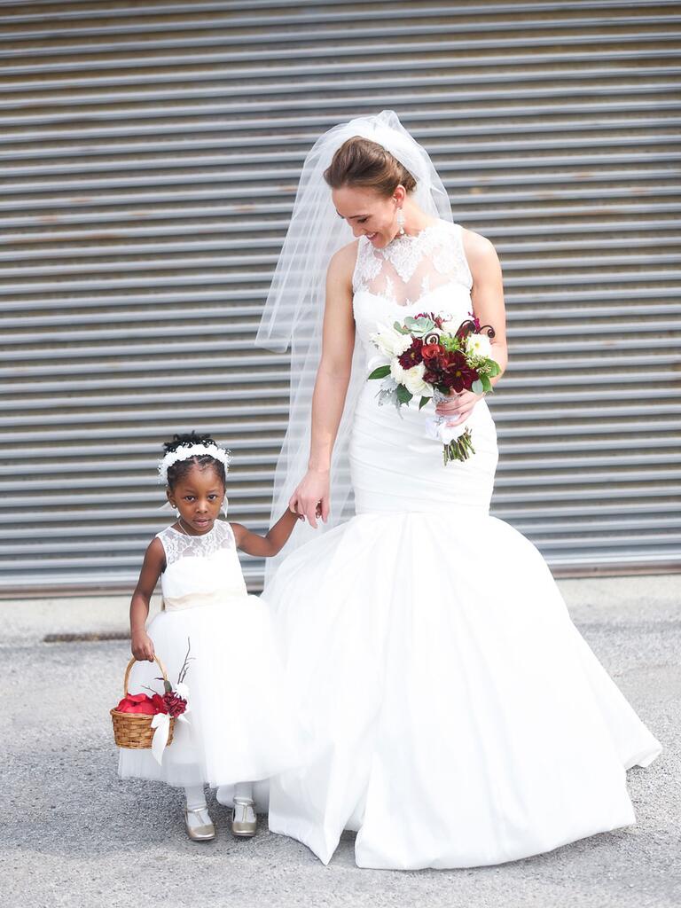 Bride and flower girl in white on wedding day
