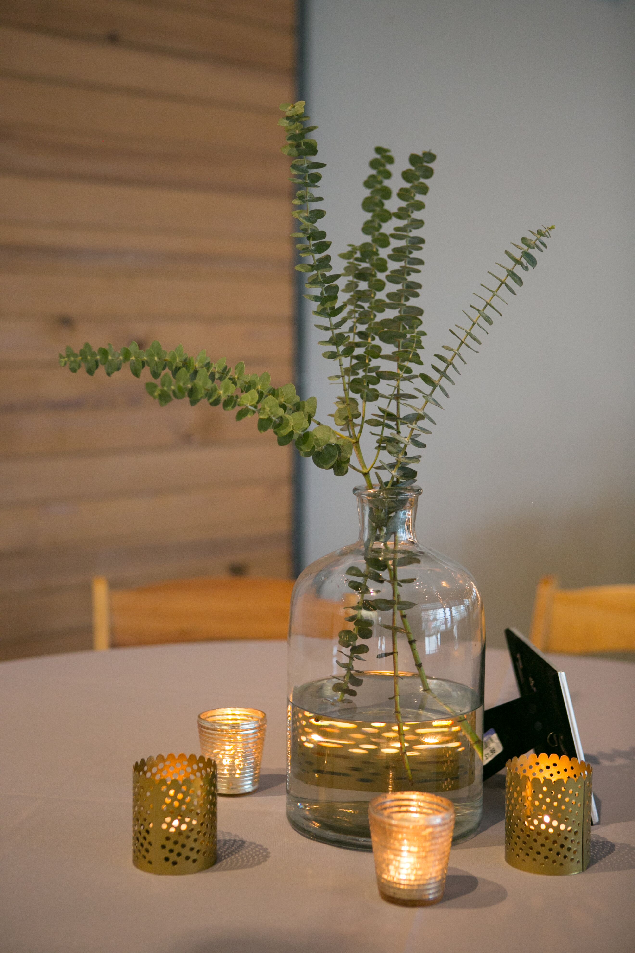 Simple Eucalyptus Branch Centerpiece with Metallic Votives