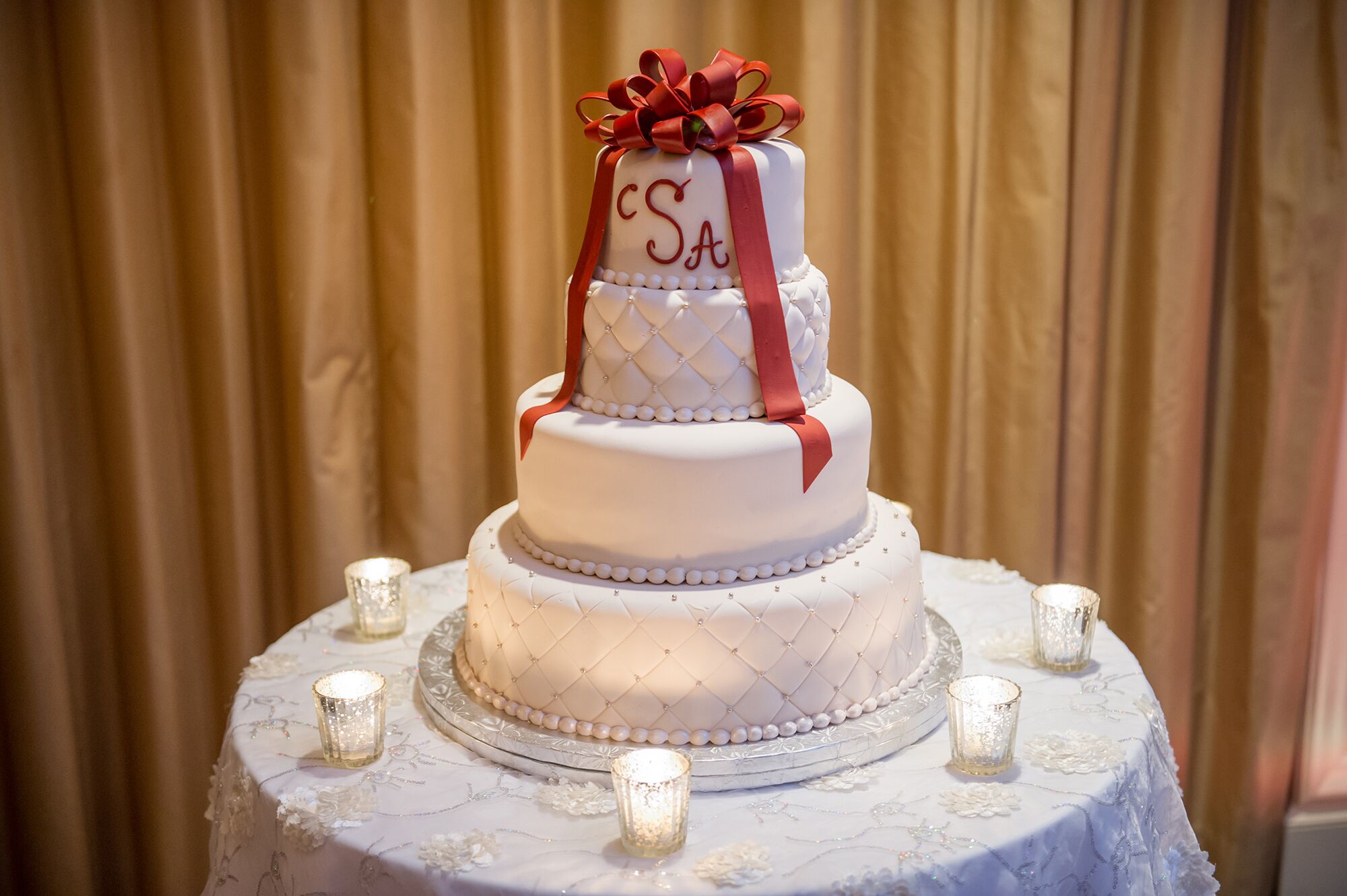 Tiered Wedding Cake With Red Fondant Ribbon