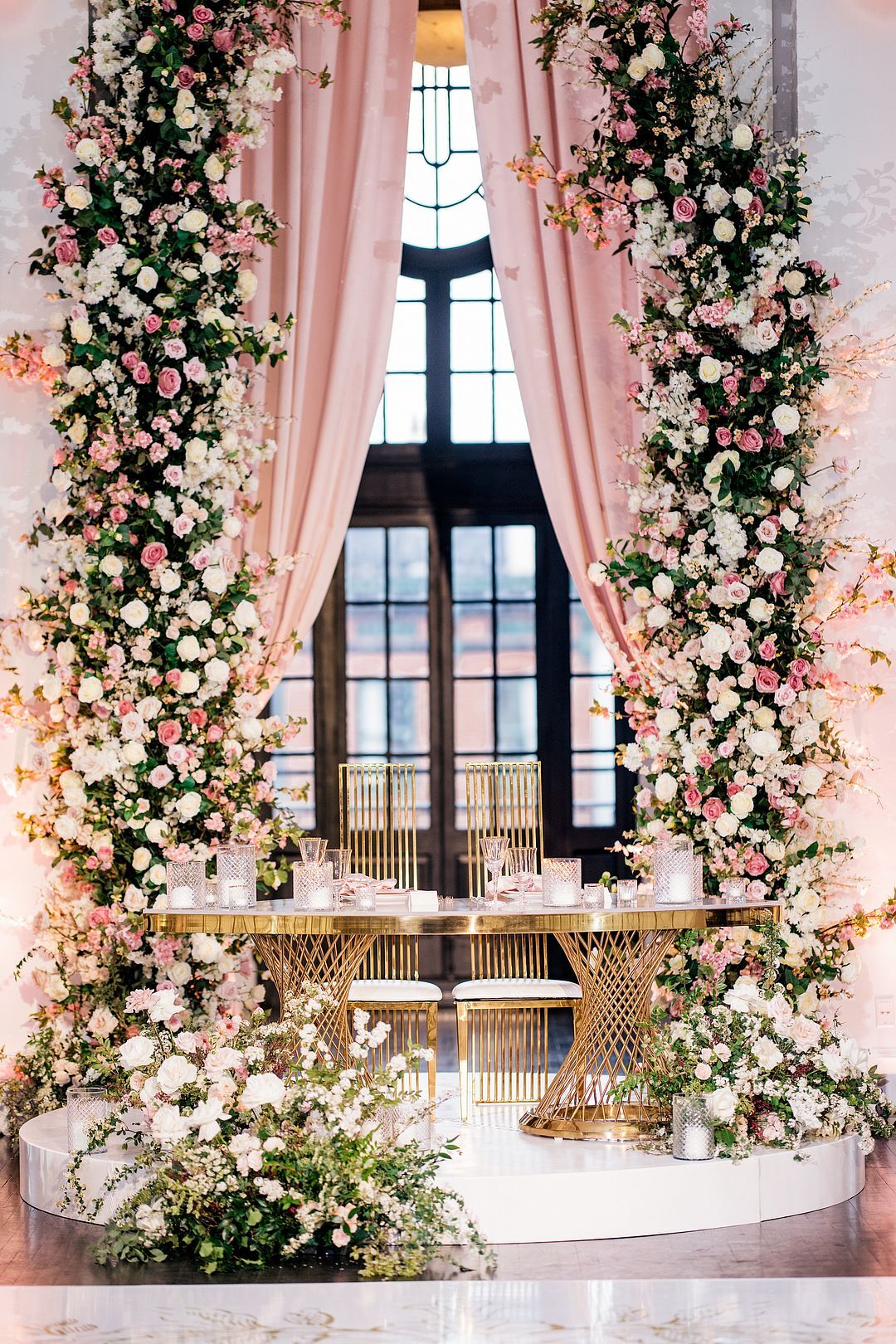 Sweetheart Table With Towering Flowers in Shades of Pink for Fairytale ...