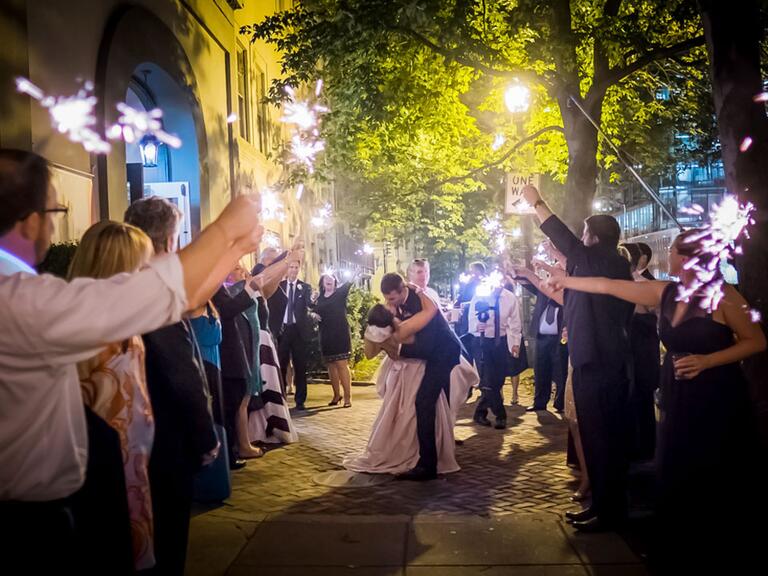 couple kissing during sparkler exit