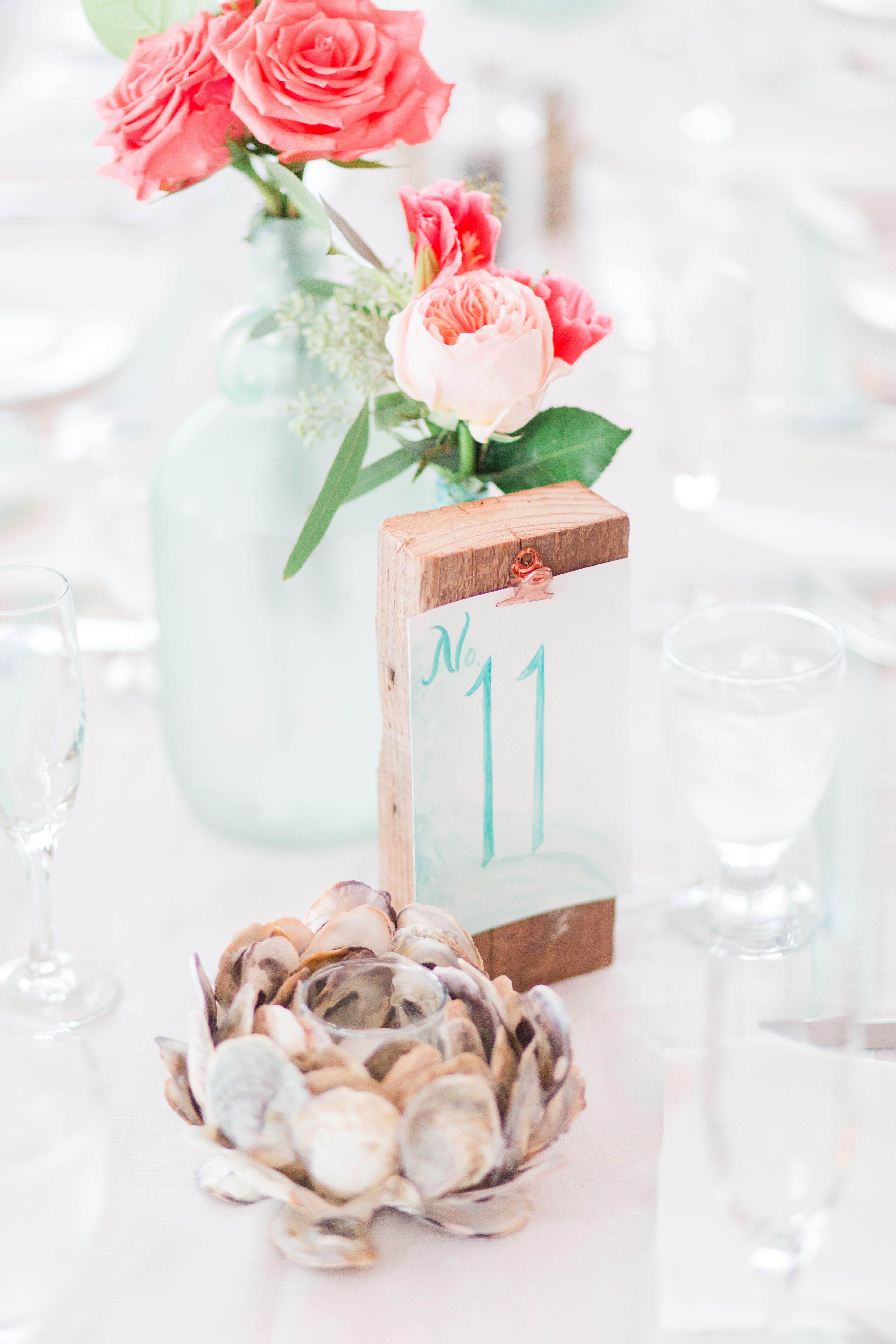 Watercolor Table Number With Seashell Decor And Rose Centerpiece