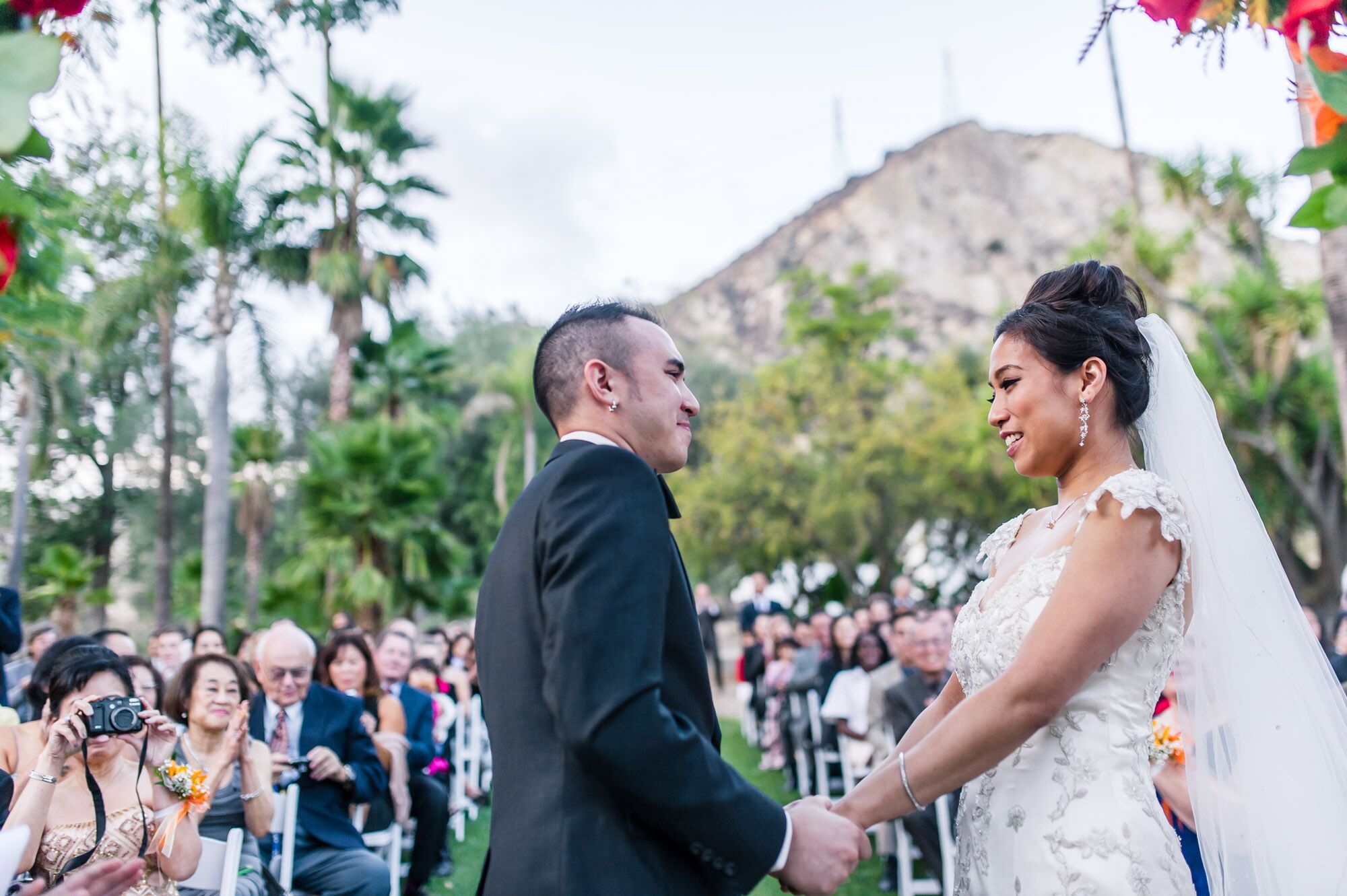 Bride and Groom Gracefully Exit Under a Foam Glow Stick Arch