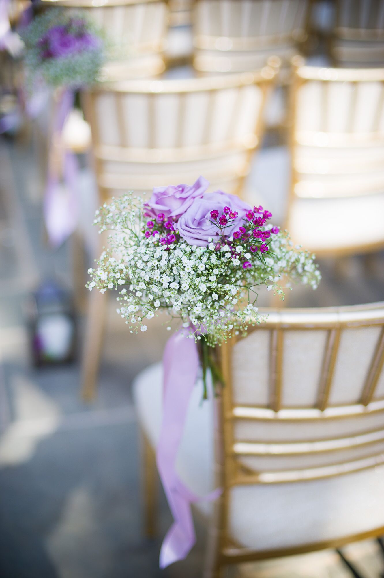 Purple and White Aisle Decorations on Gold Chiavari Chairs