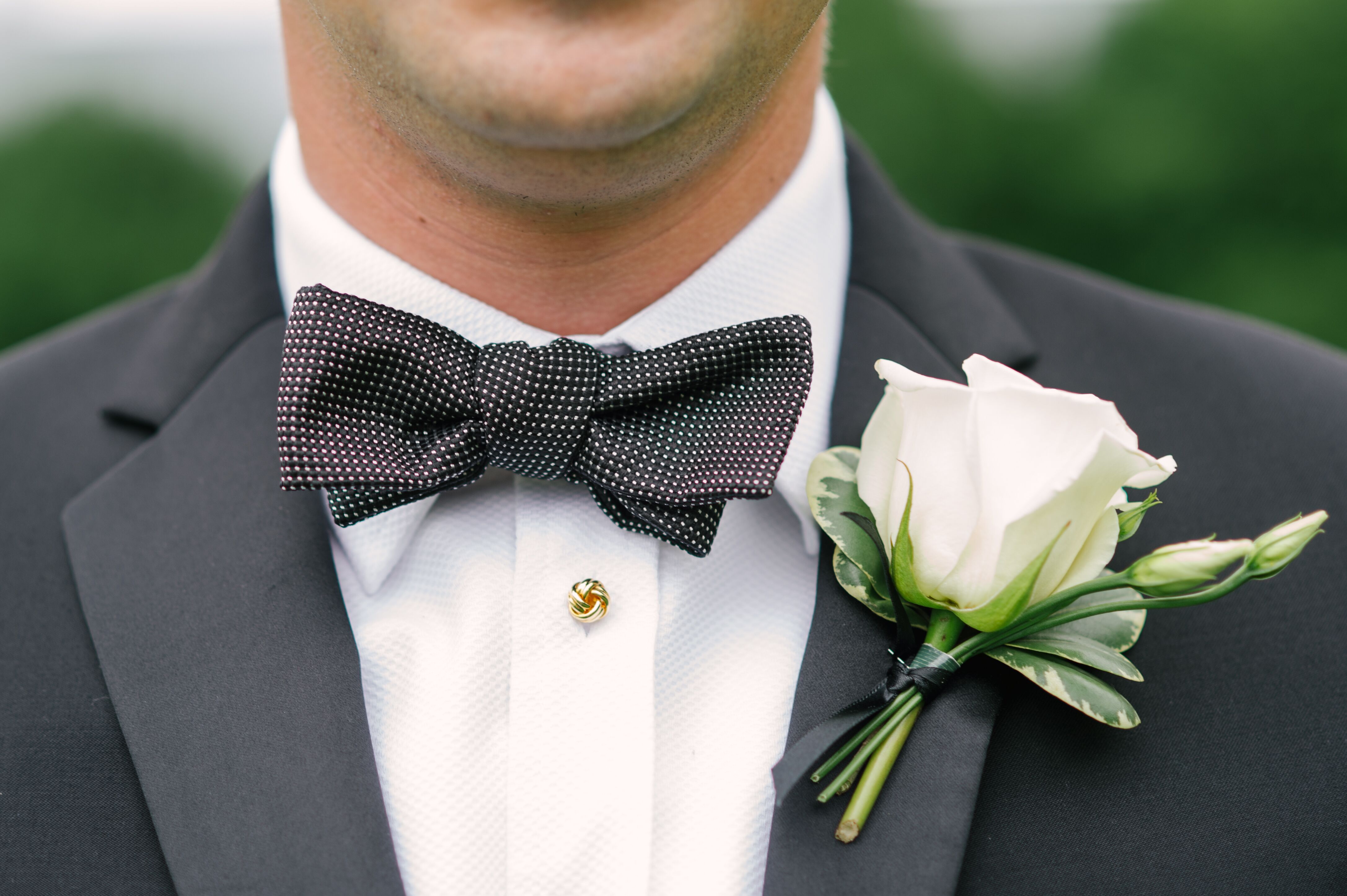 White Rose Boutonniere With Black Bow Tie