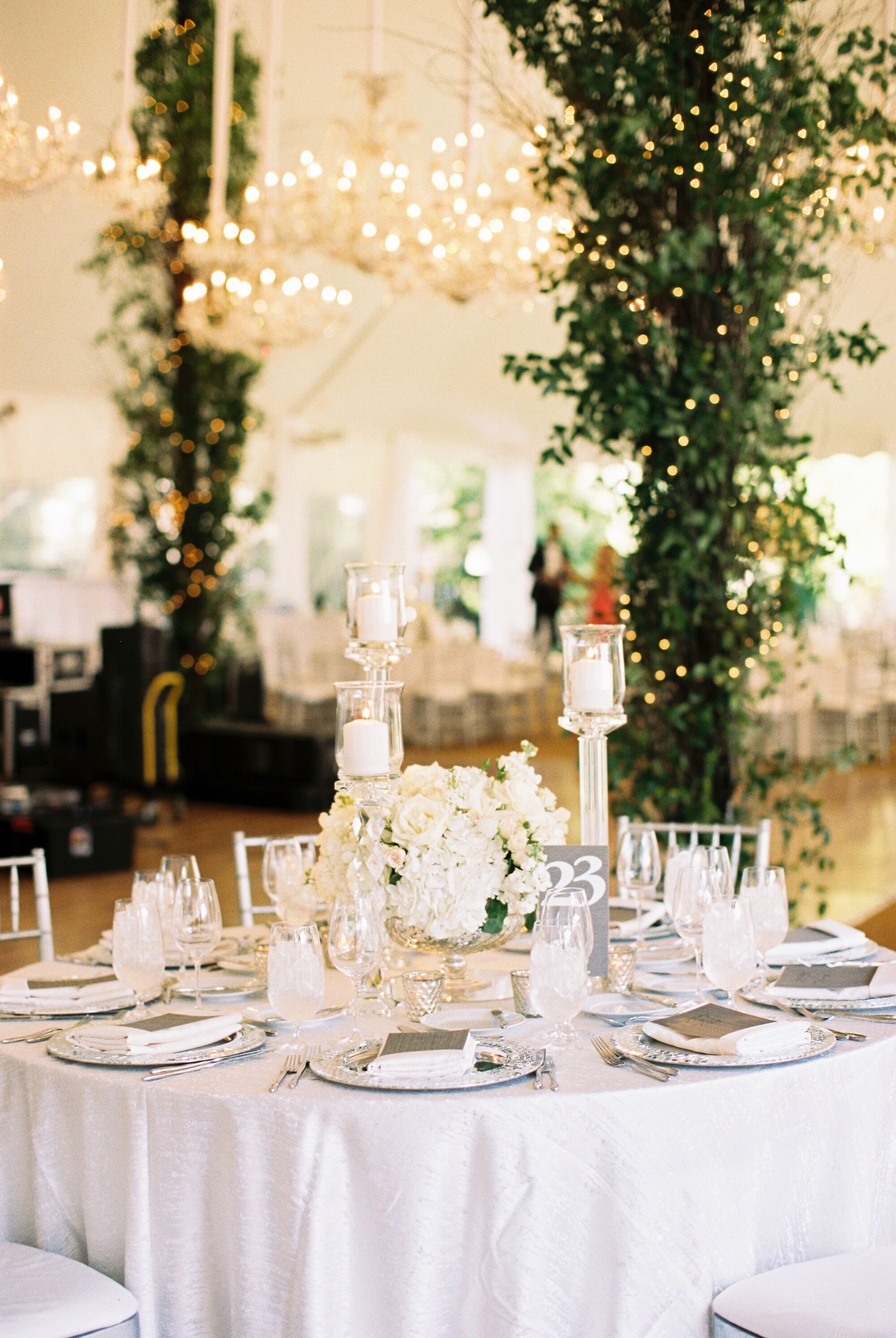 Round Reception Tables Dressed with White and Metallic Details