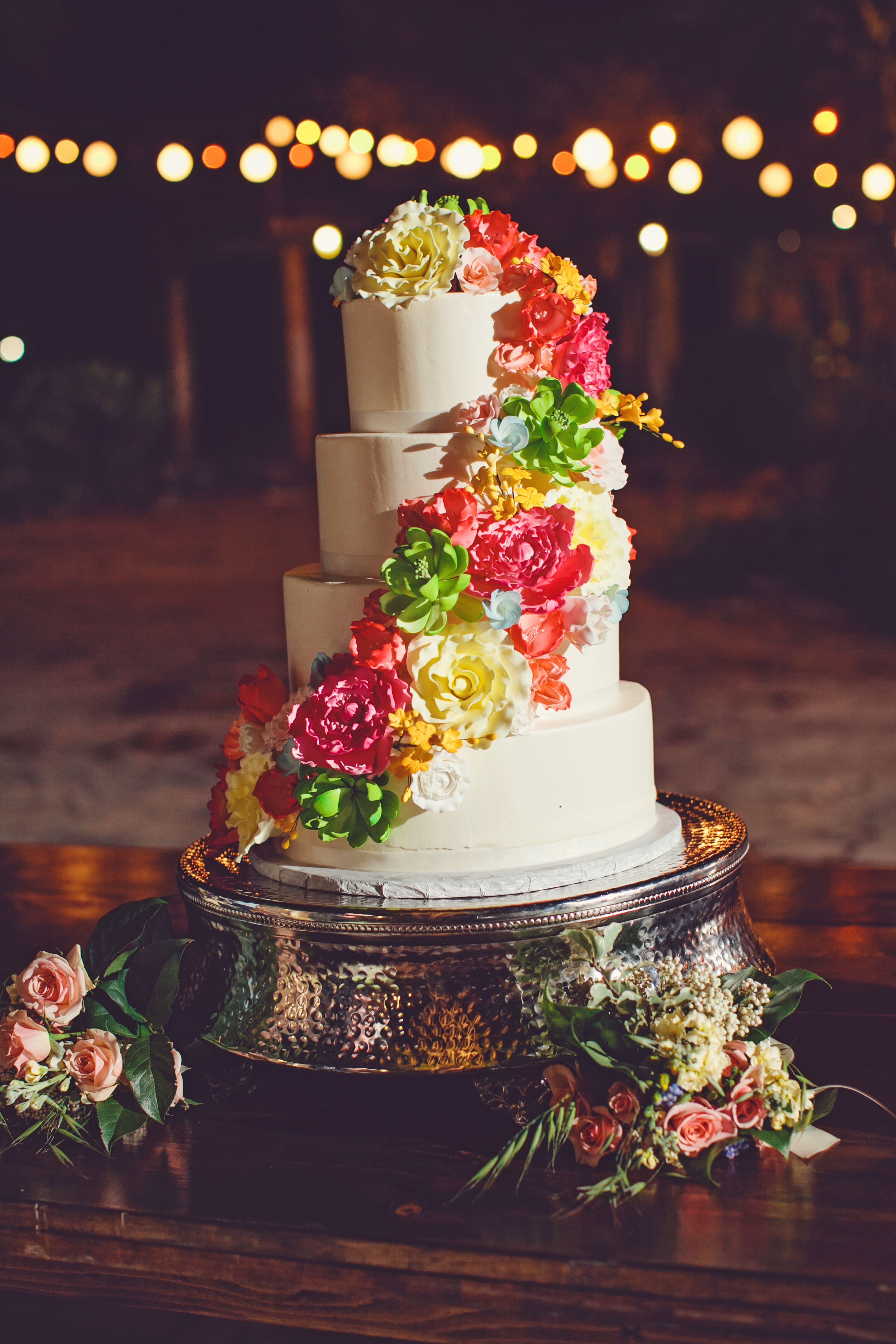 Four Tier Wedding Cake with Multicolored Flowers