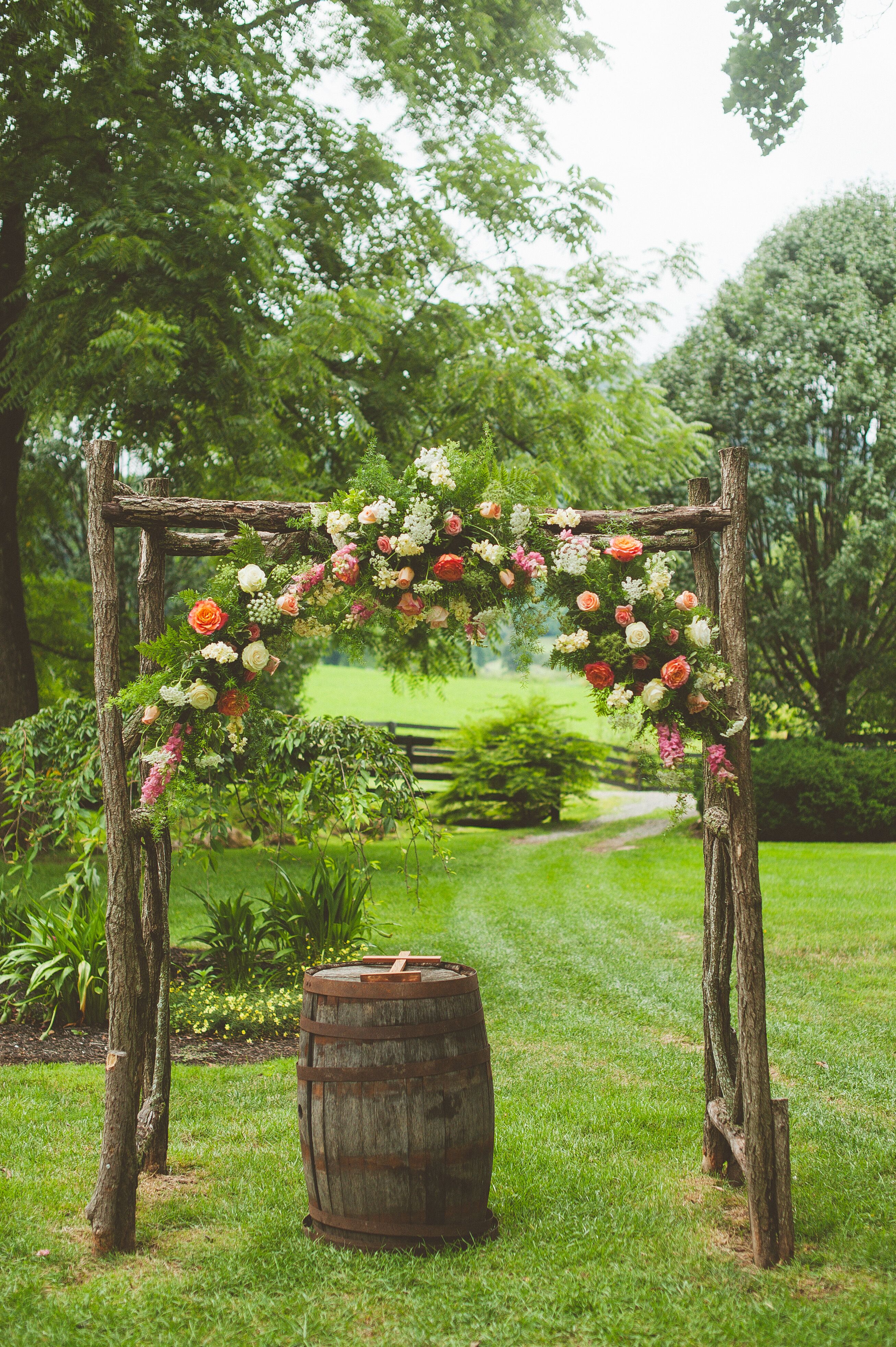 Wooden Wedding Arch With Coral Flowers