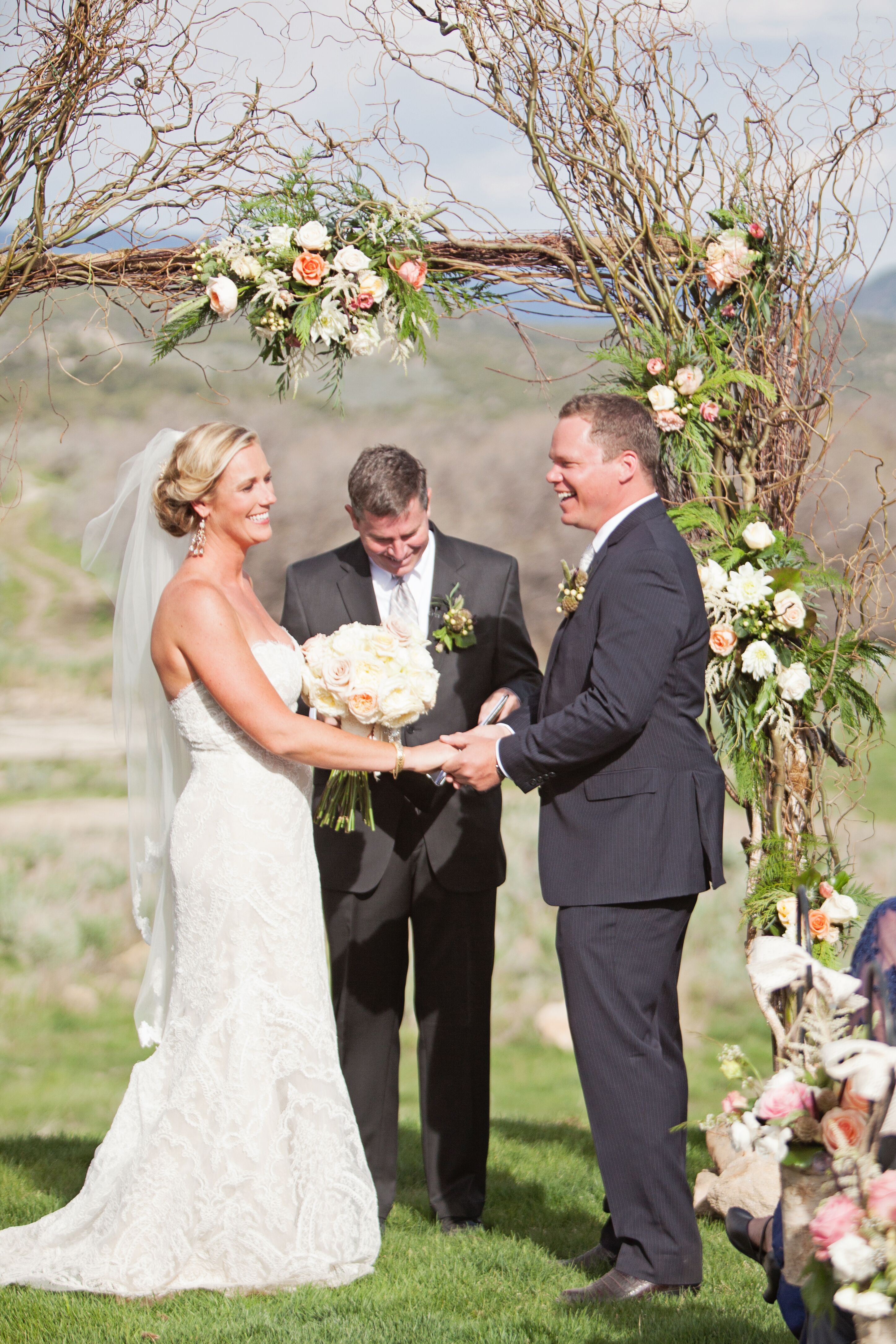 Wood Branch and Rose-Decorated Wedding Arbor