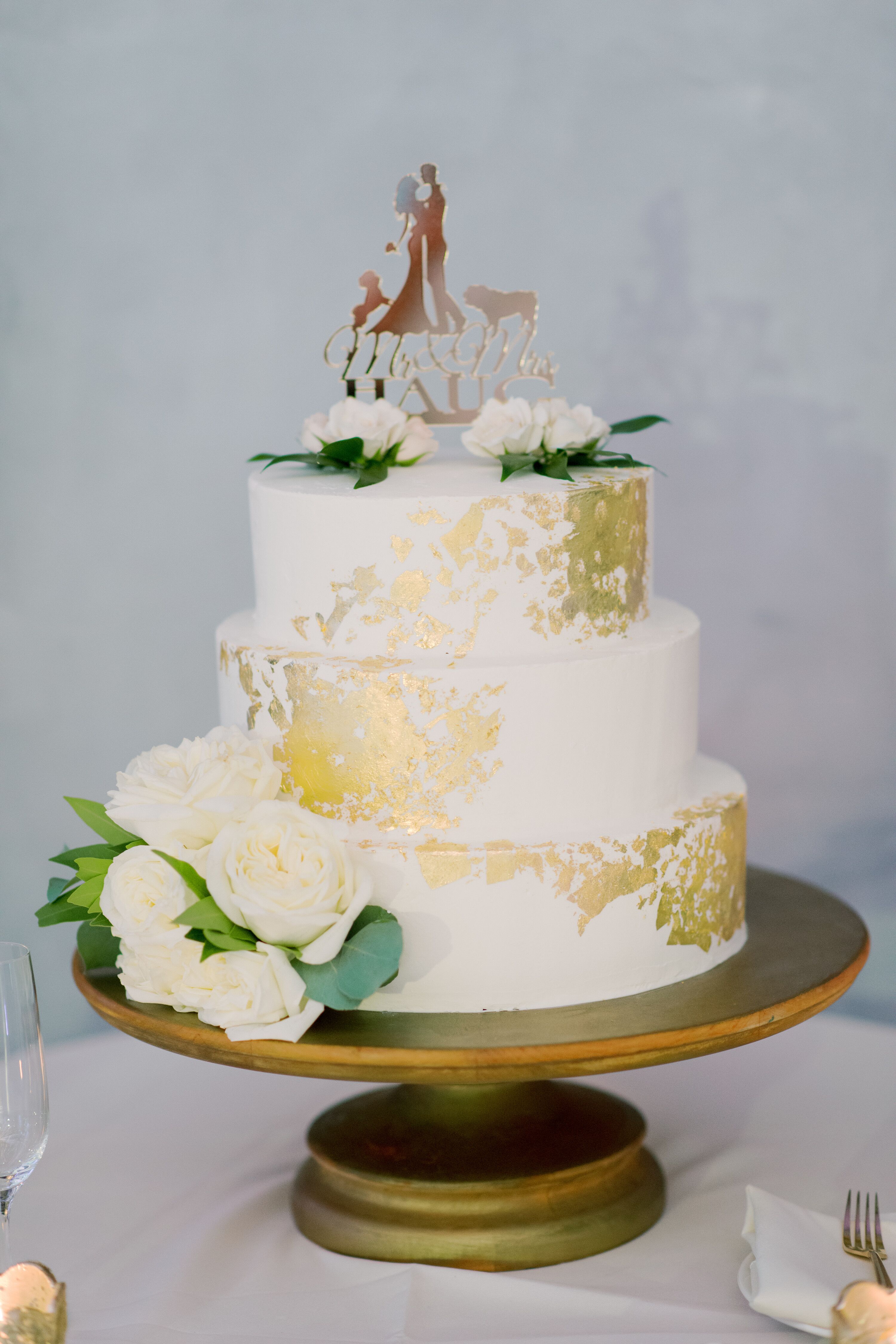 White Cake With Gold Leading and Custom Cake Topper