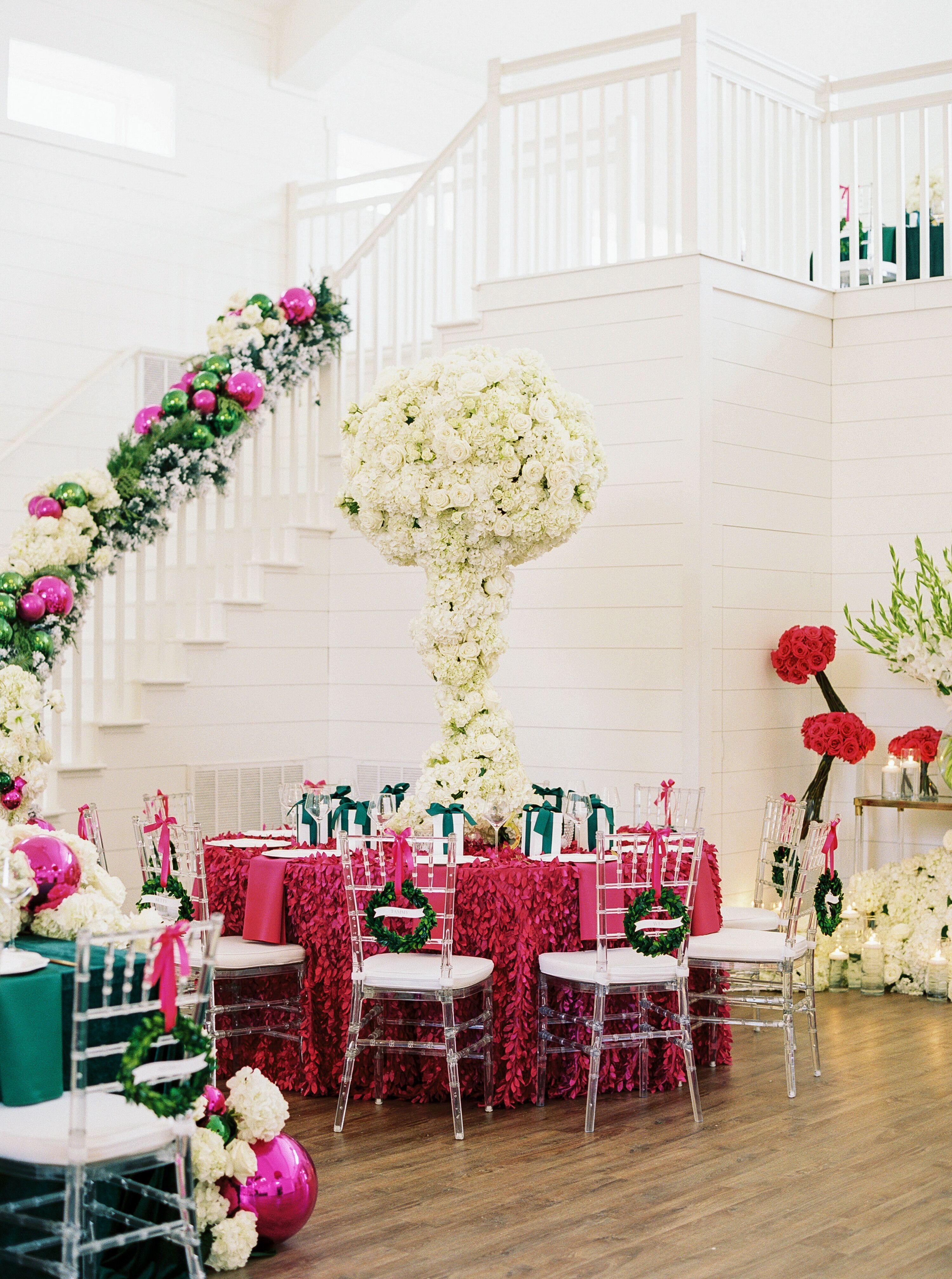 Christmas Wedding Reception With Fuchsia Table Linen and Towering ...