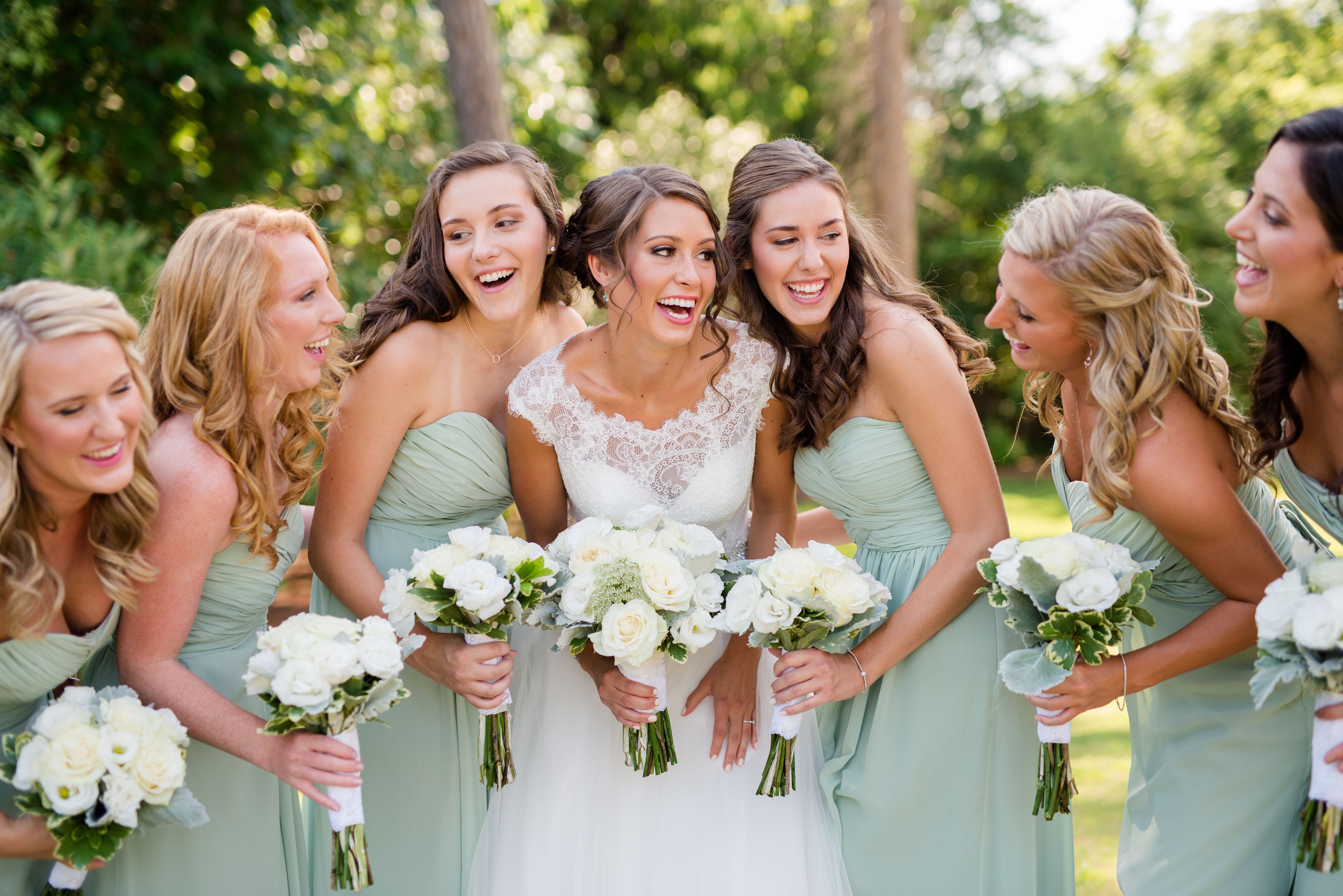 Each bridesmaid picked out her own style of a long, sage green chiffon Bill...