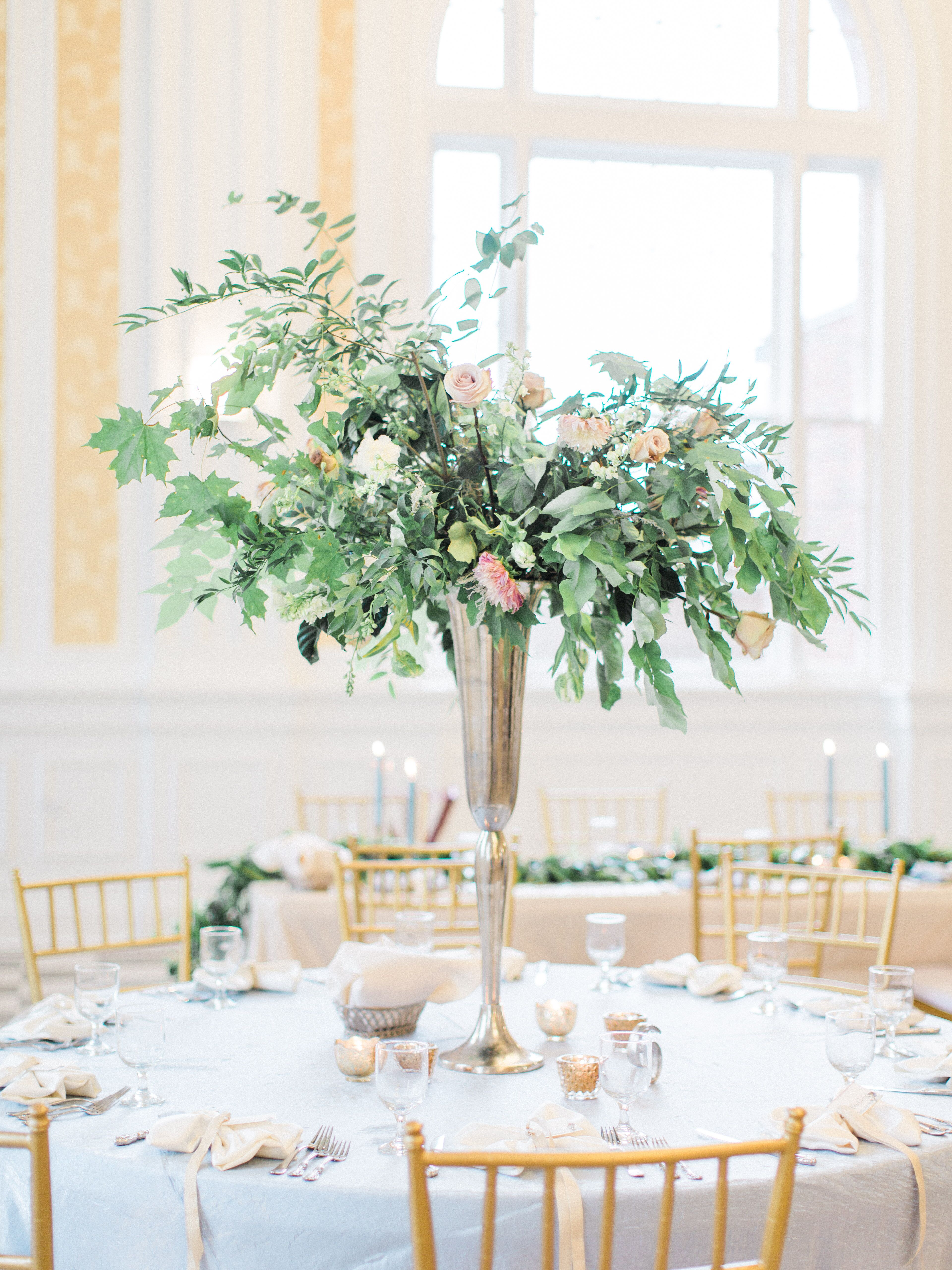 Towering Centerpieces Overflowing with Greenery