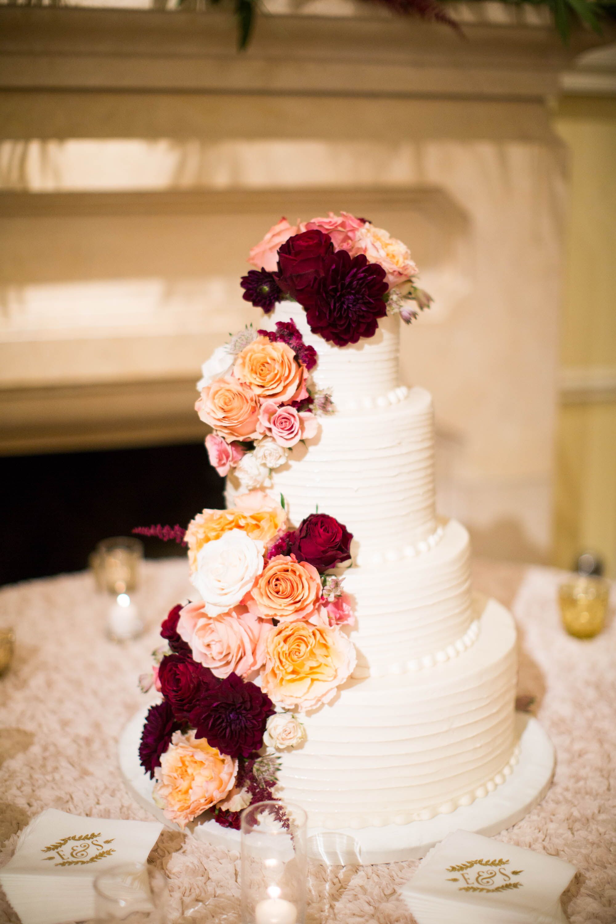 Wedding Cake with Cascading Pink and Burgundy Roses