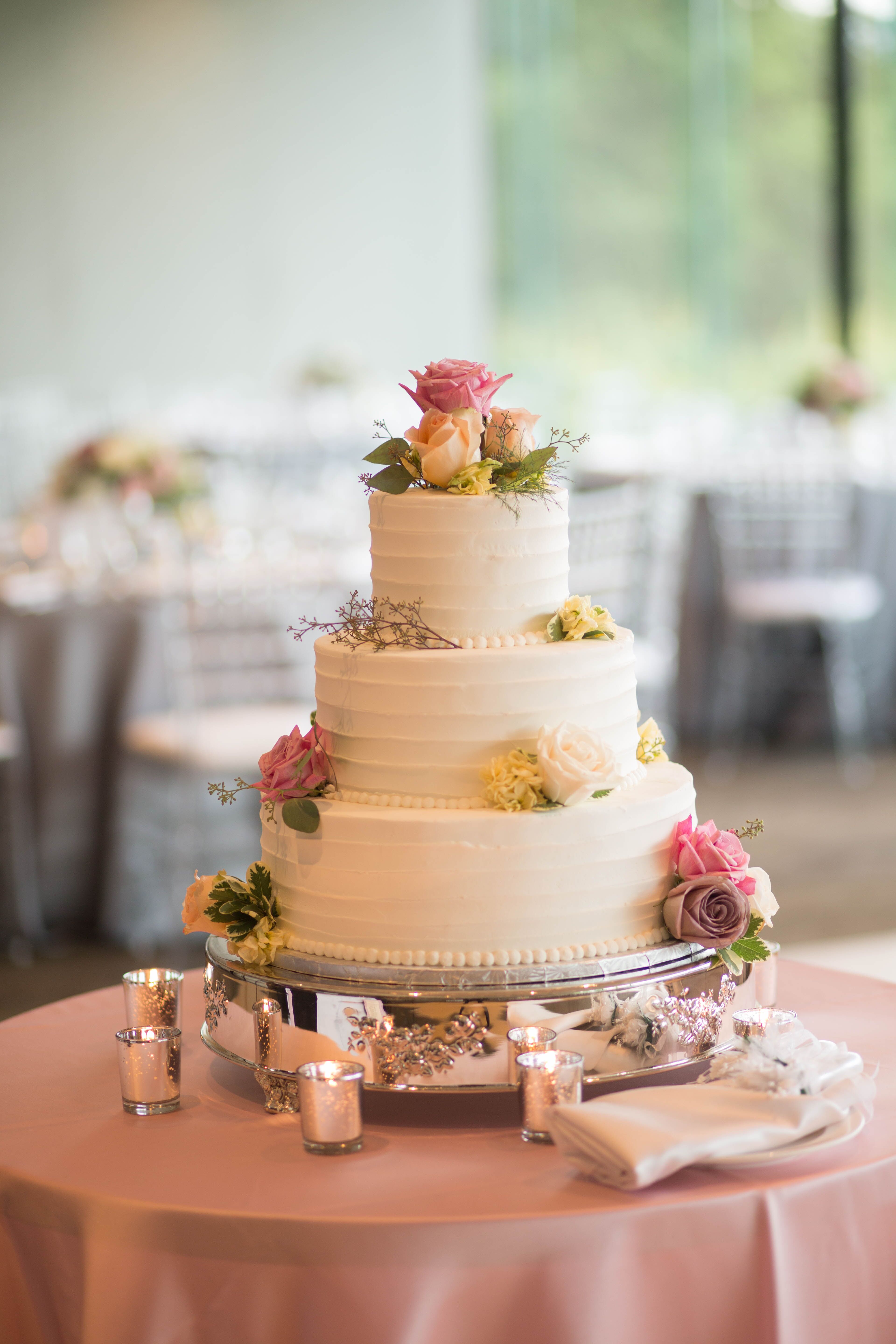 Tiered Buttercream Cake with Pastel Fresh Flowers