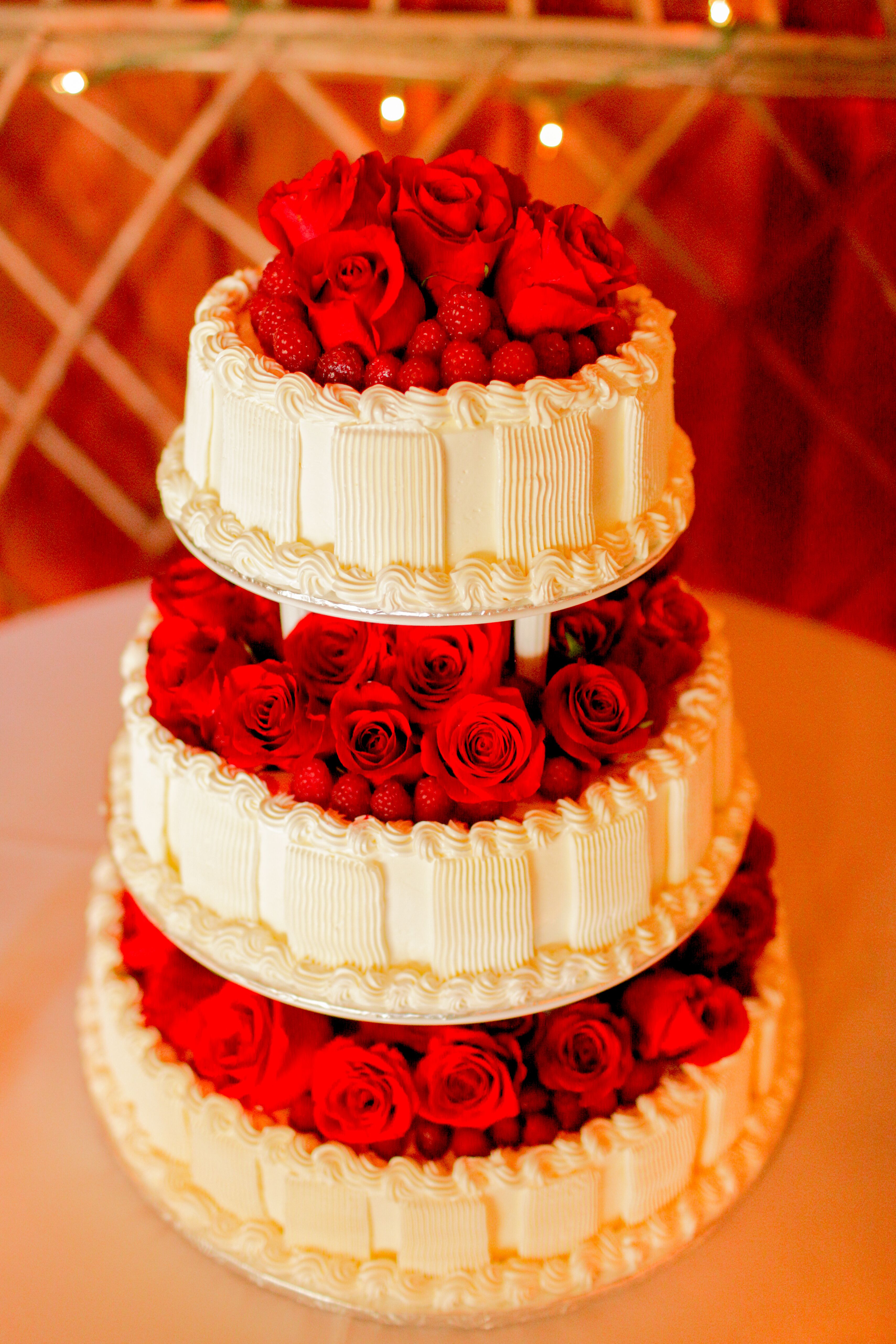 White Cake With Roses and Berries