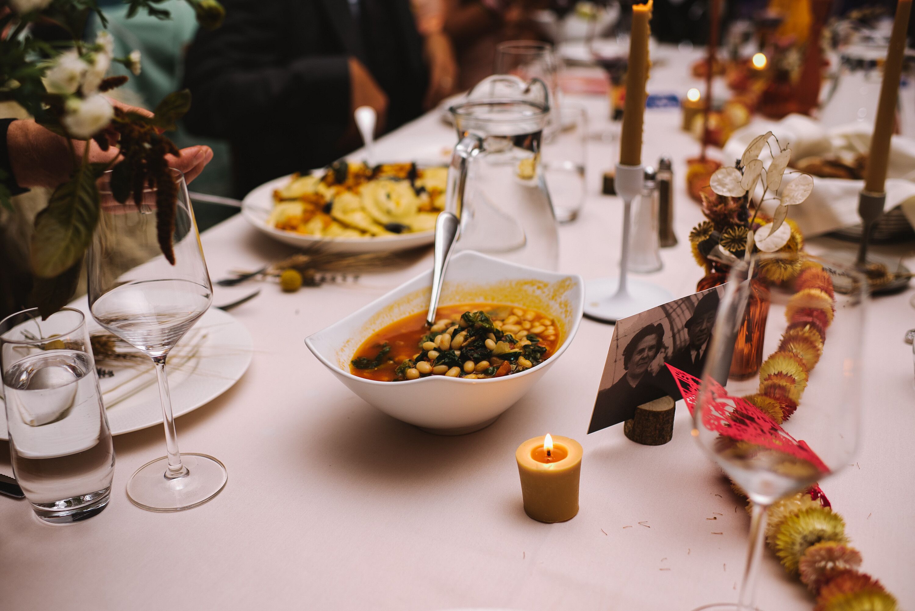 Dining Table With White Linen, Comforting Soup and Other Dinner Foods ...