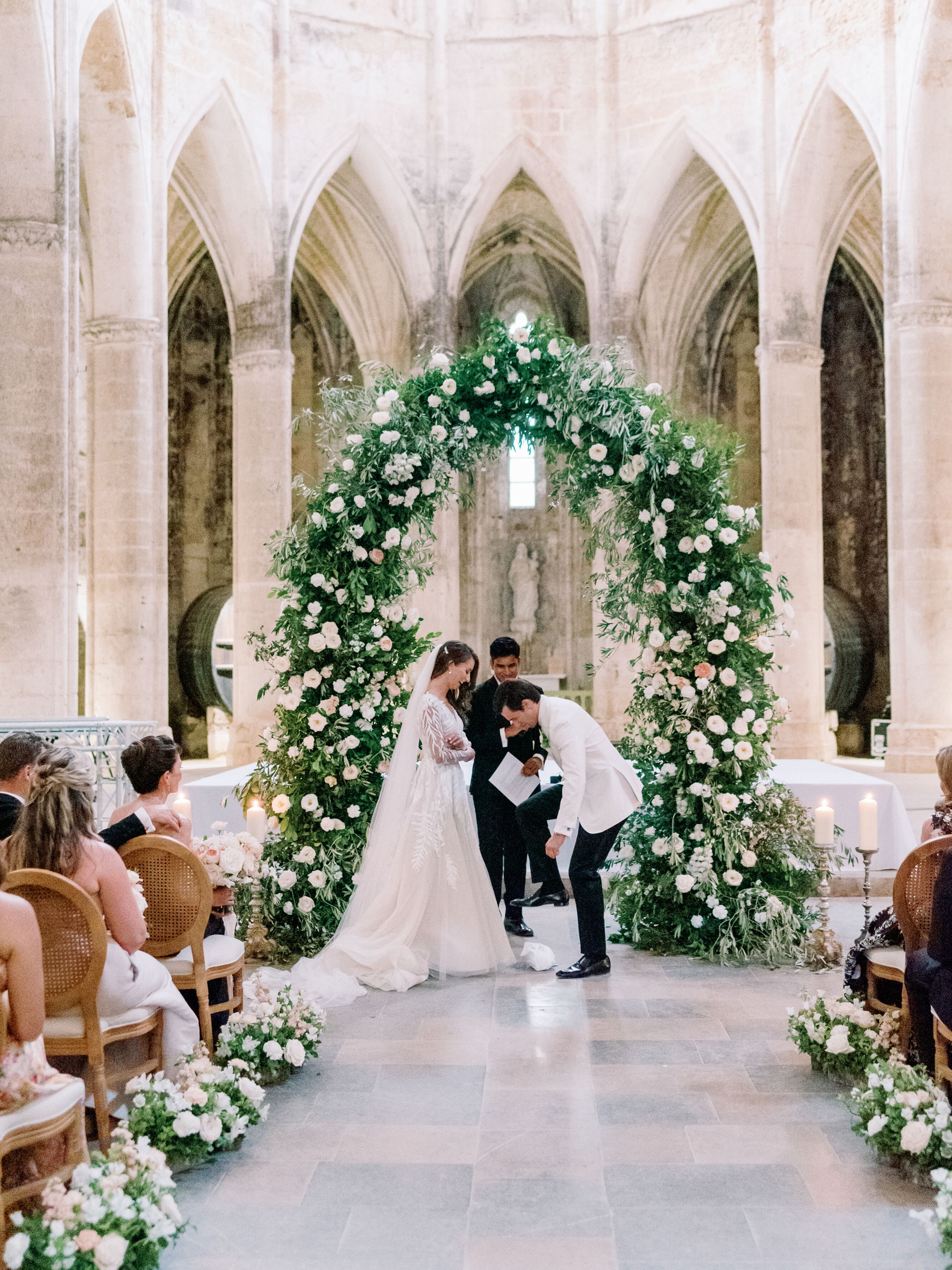 Bride With Long Veil, Groom in White Tuxedo Jacket Breaking the Glass ...