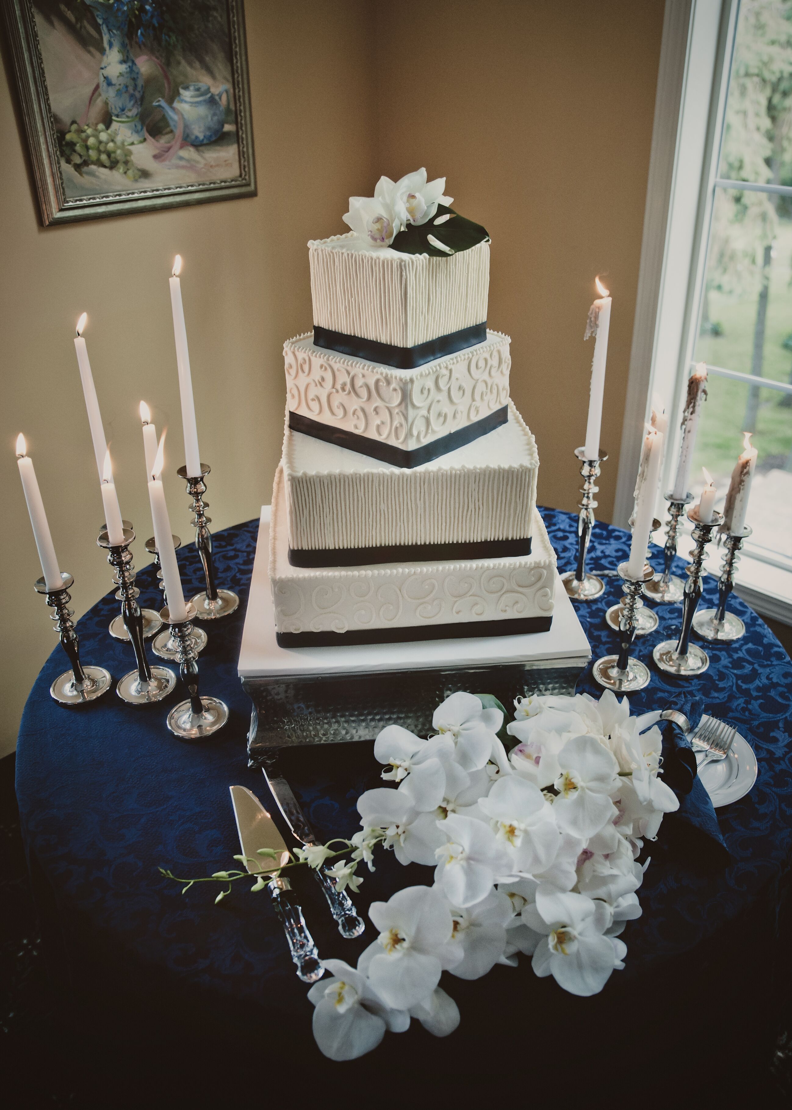 Four-Tier White and Navy Wedding Cake