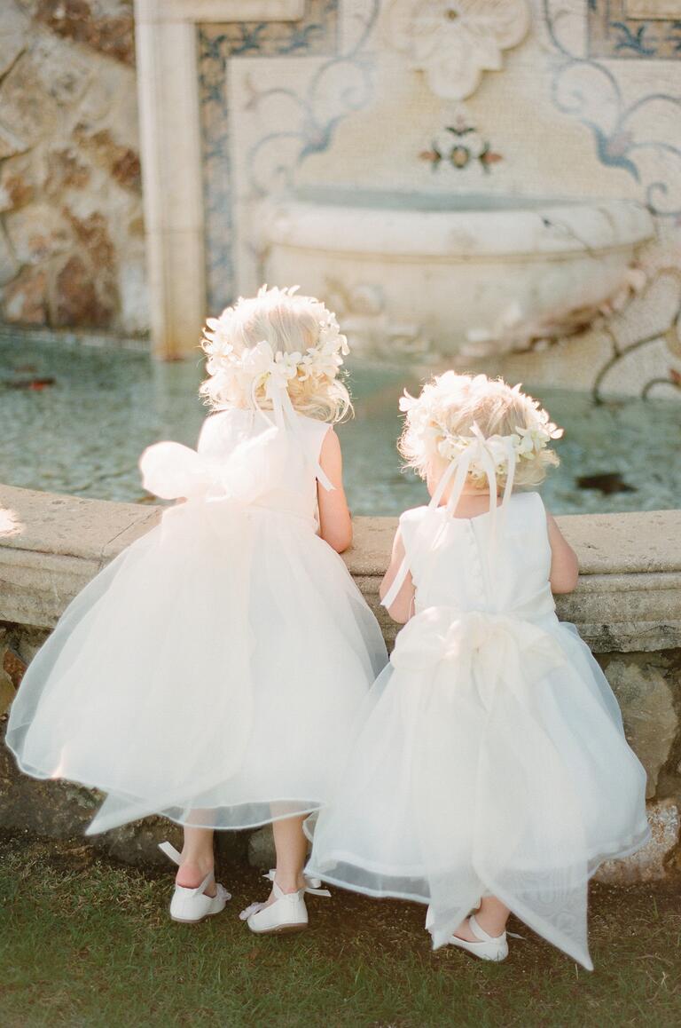 Flower girls with white tulle dresses and flower crowns