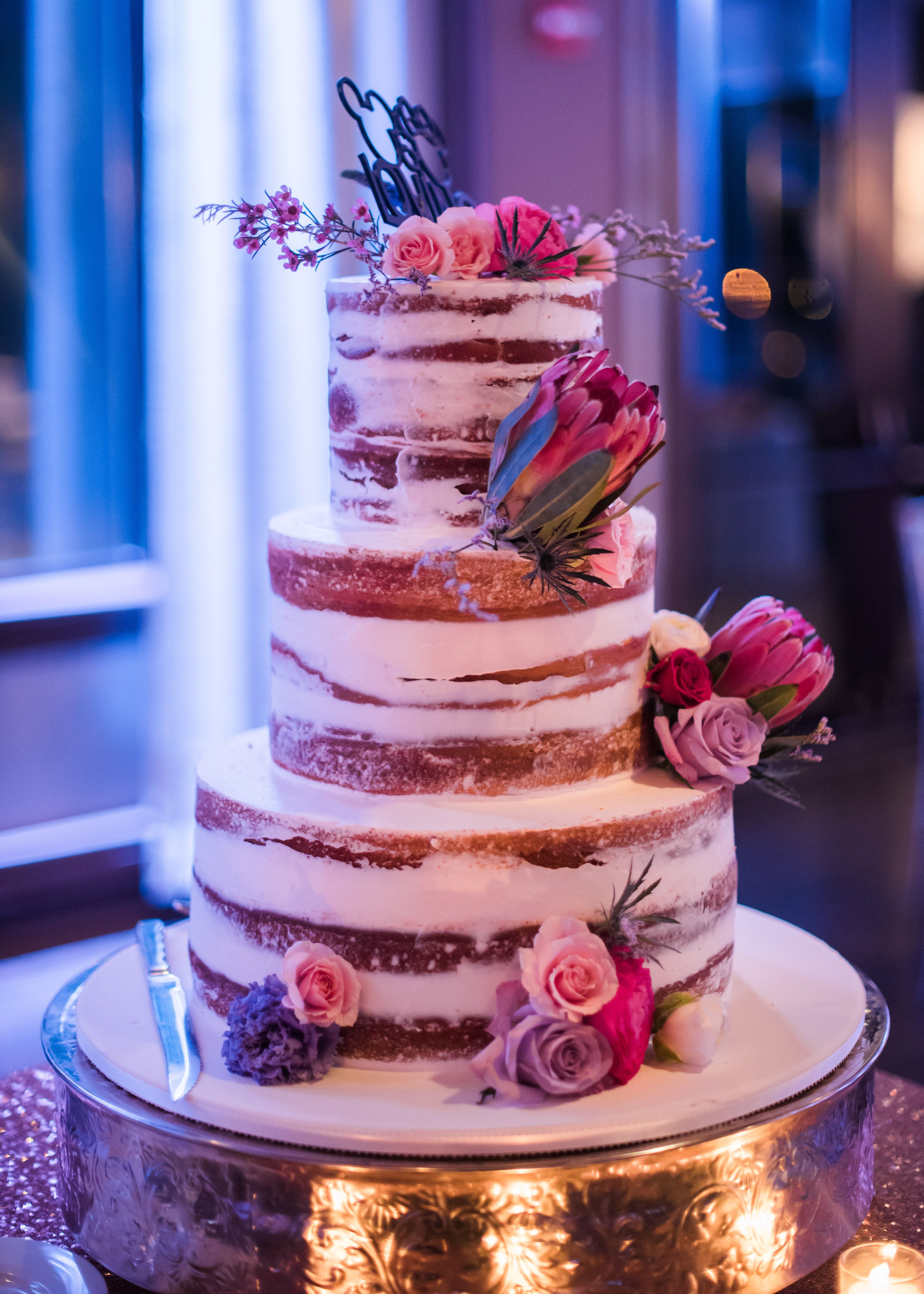 Naked Wedding Cake With Pink Flowers