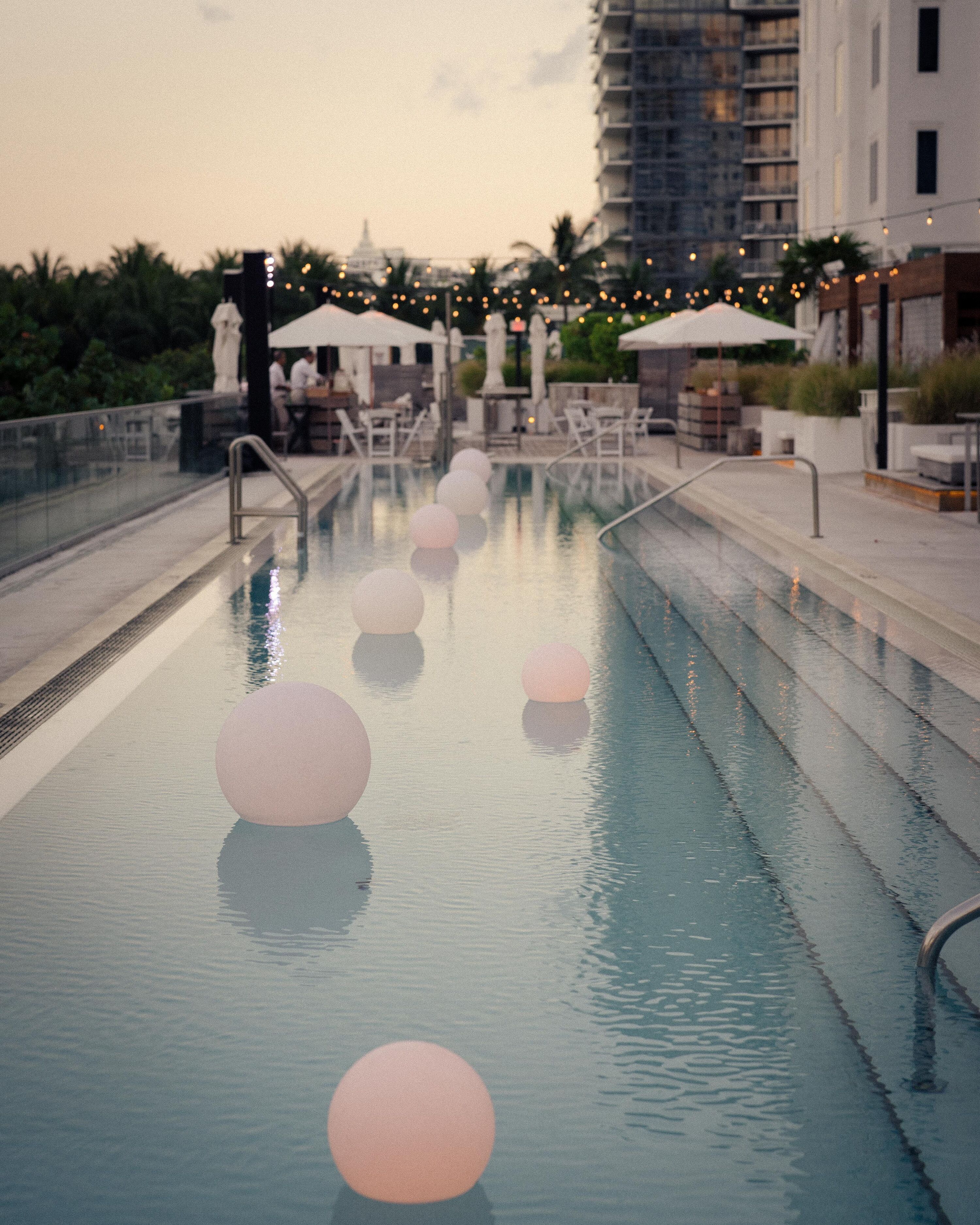 Pool at Cocktail Hour With Illuminated Lanterns