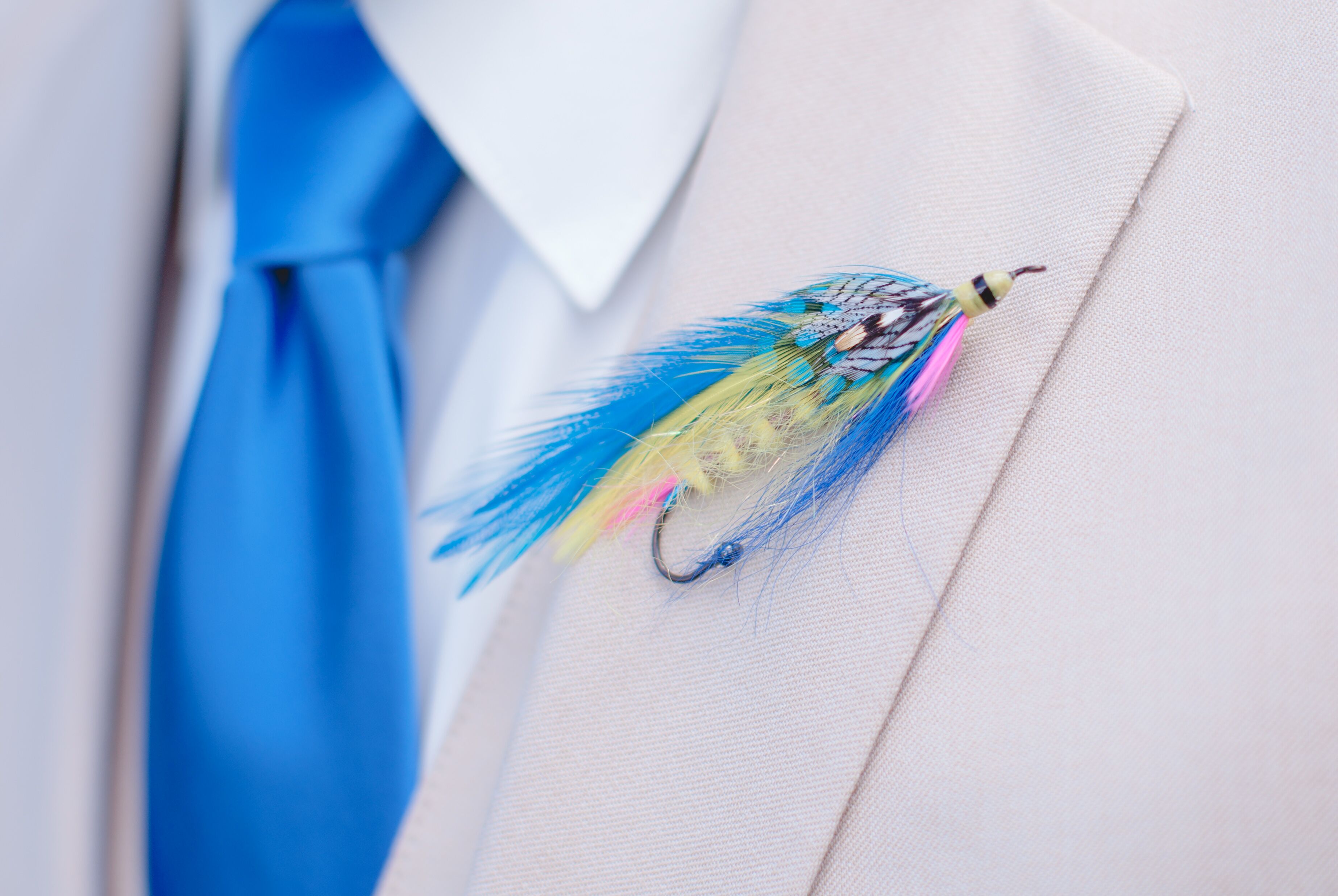 Groom Wearing Tie And Fly Fish Boutonniere by Stocksy Contributor