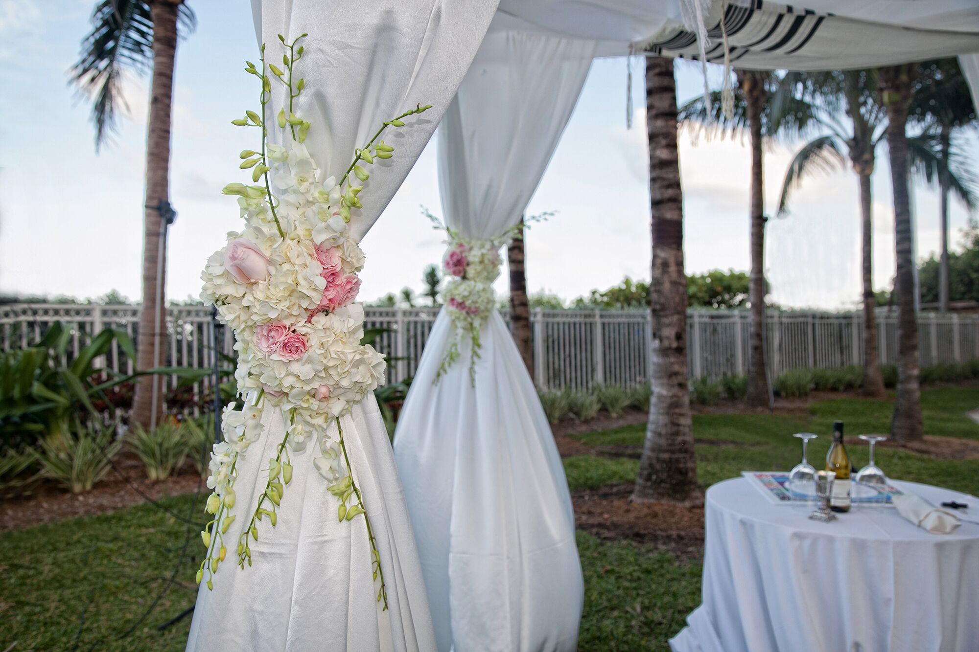 Luxury Jewish chuppah with white hydrangeas and pink garden roses