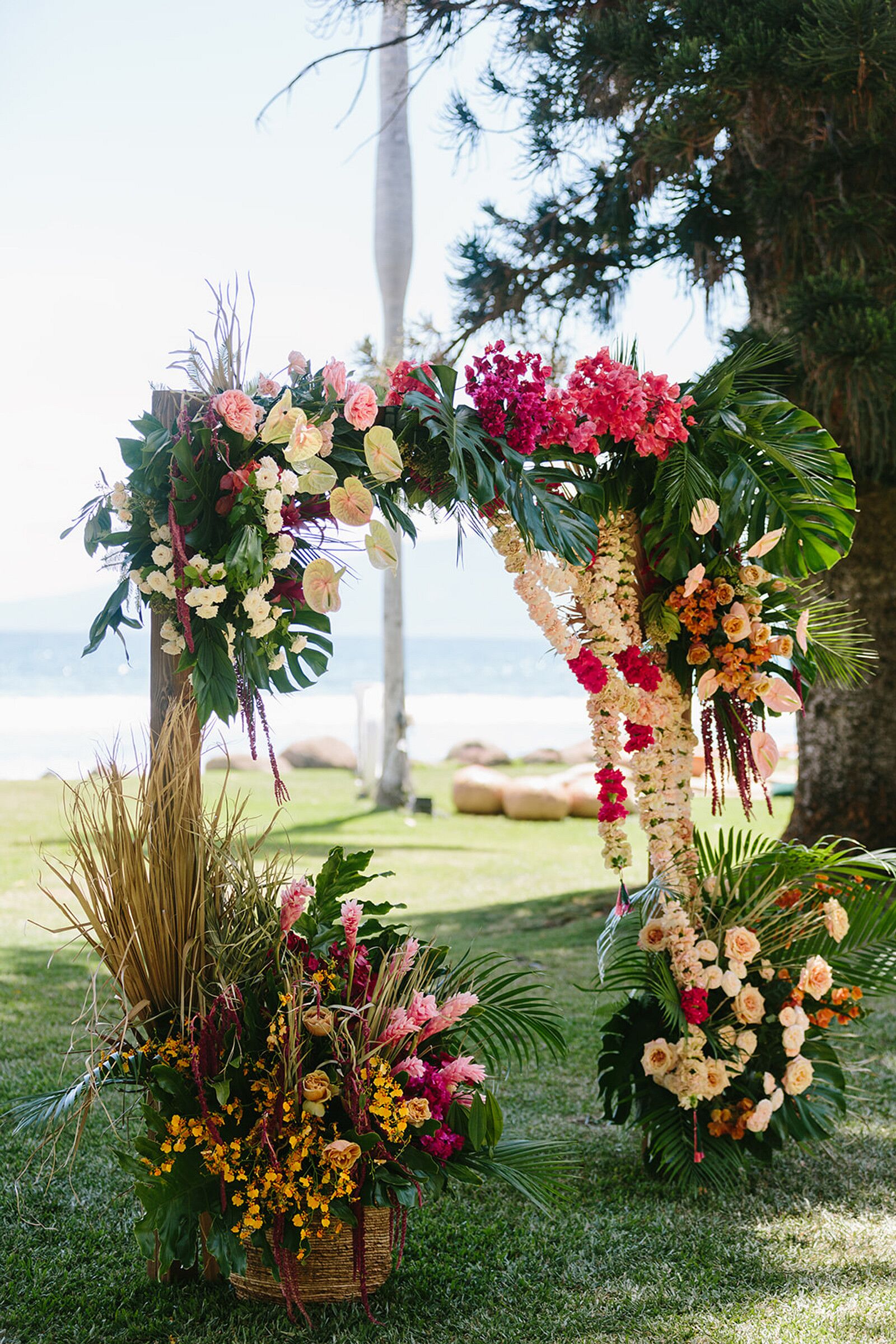 Tropical Ceremony Arch Adorned With Colorful Flowers and Leis in Hawaii