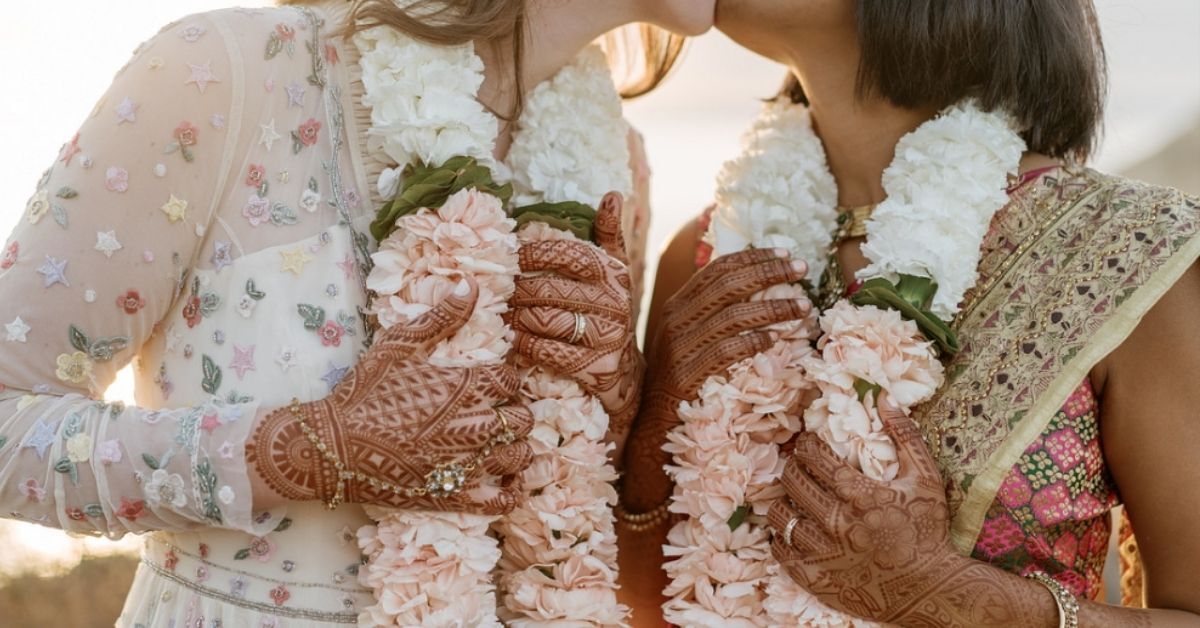 indian punjabi wedding couple holding hands