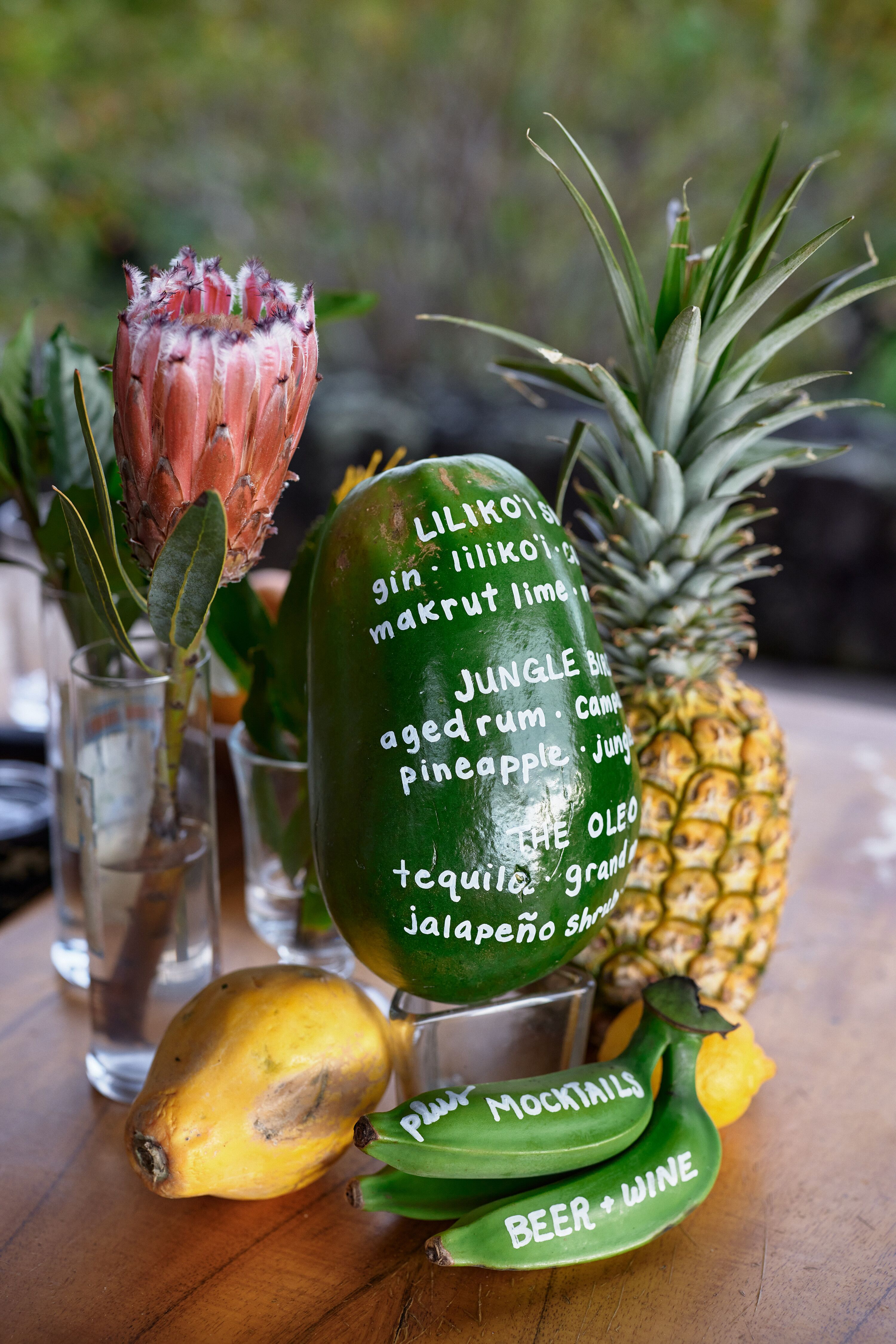 Cocktail Menu Written on Tropical Fruits