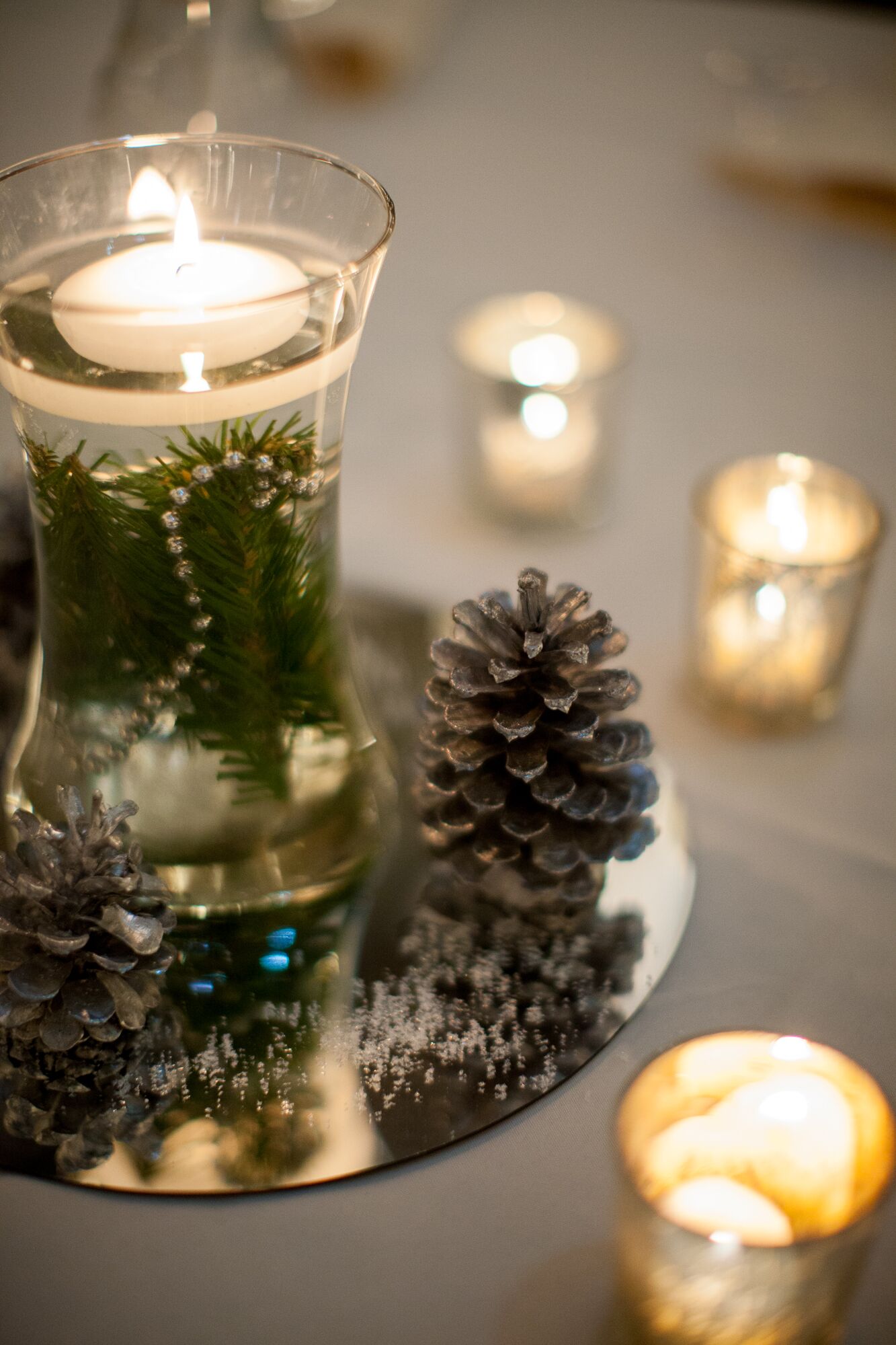 DIY Floating Winter Tea Candle Centerpieces with Pinecones