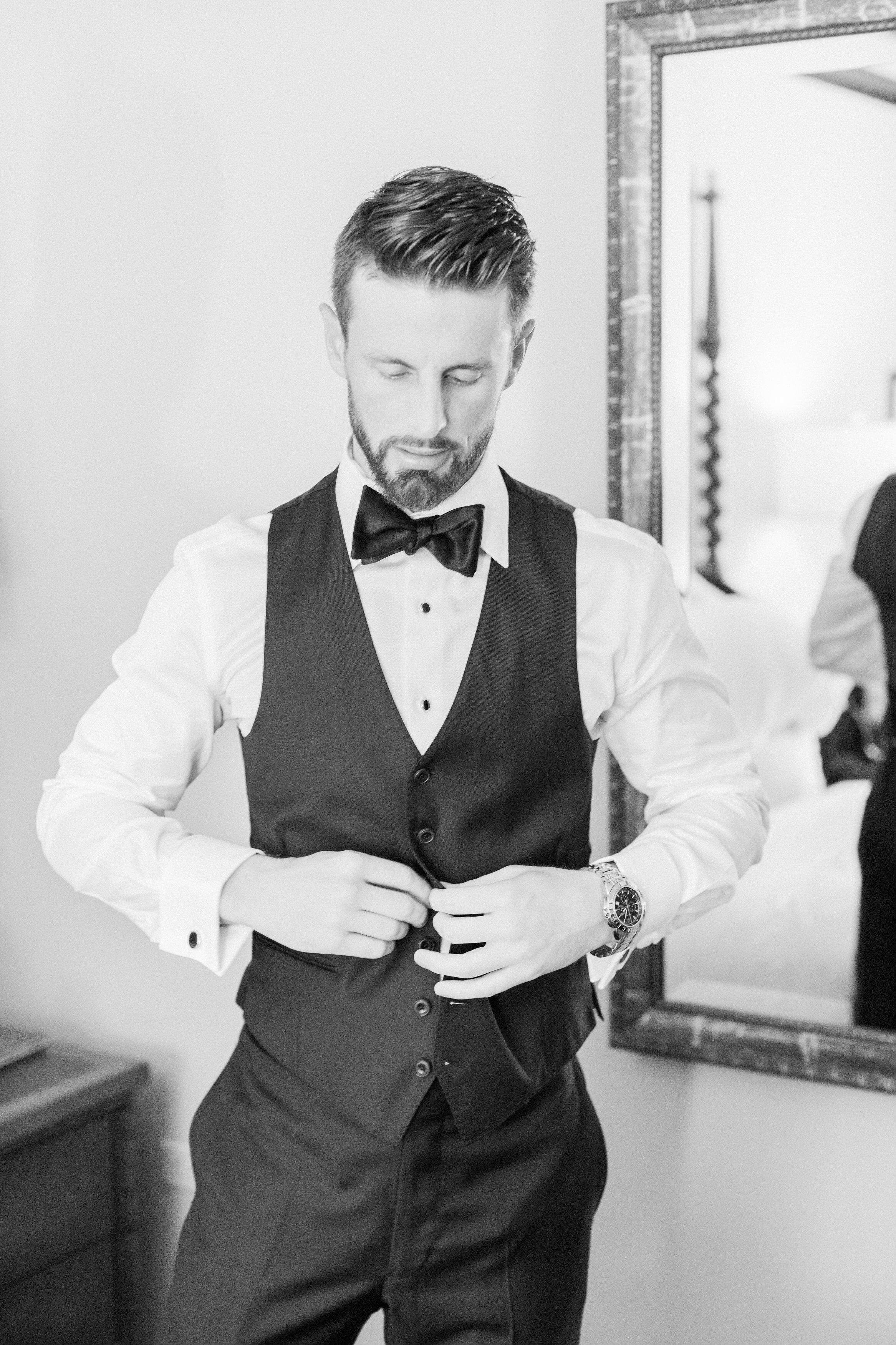 Groom's Classic Black Suite With Vest and Bow Tie