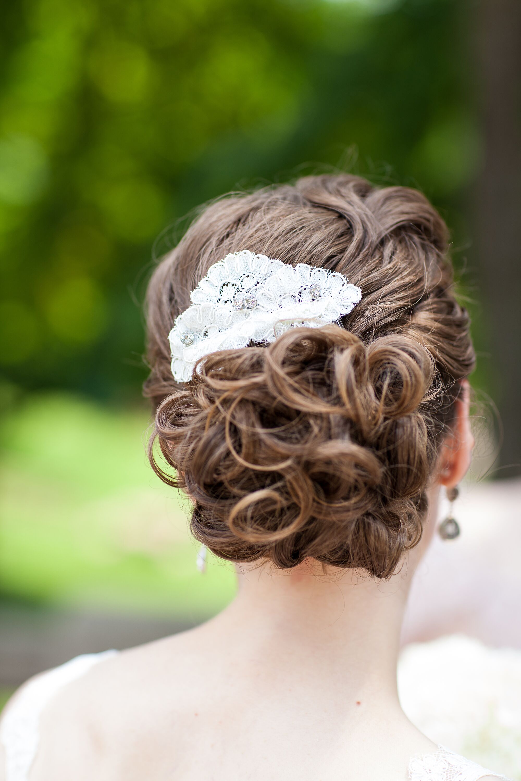 Curly Updo With White Hairpin Comb