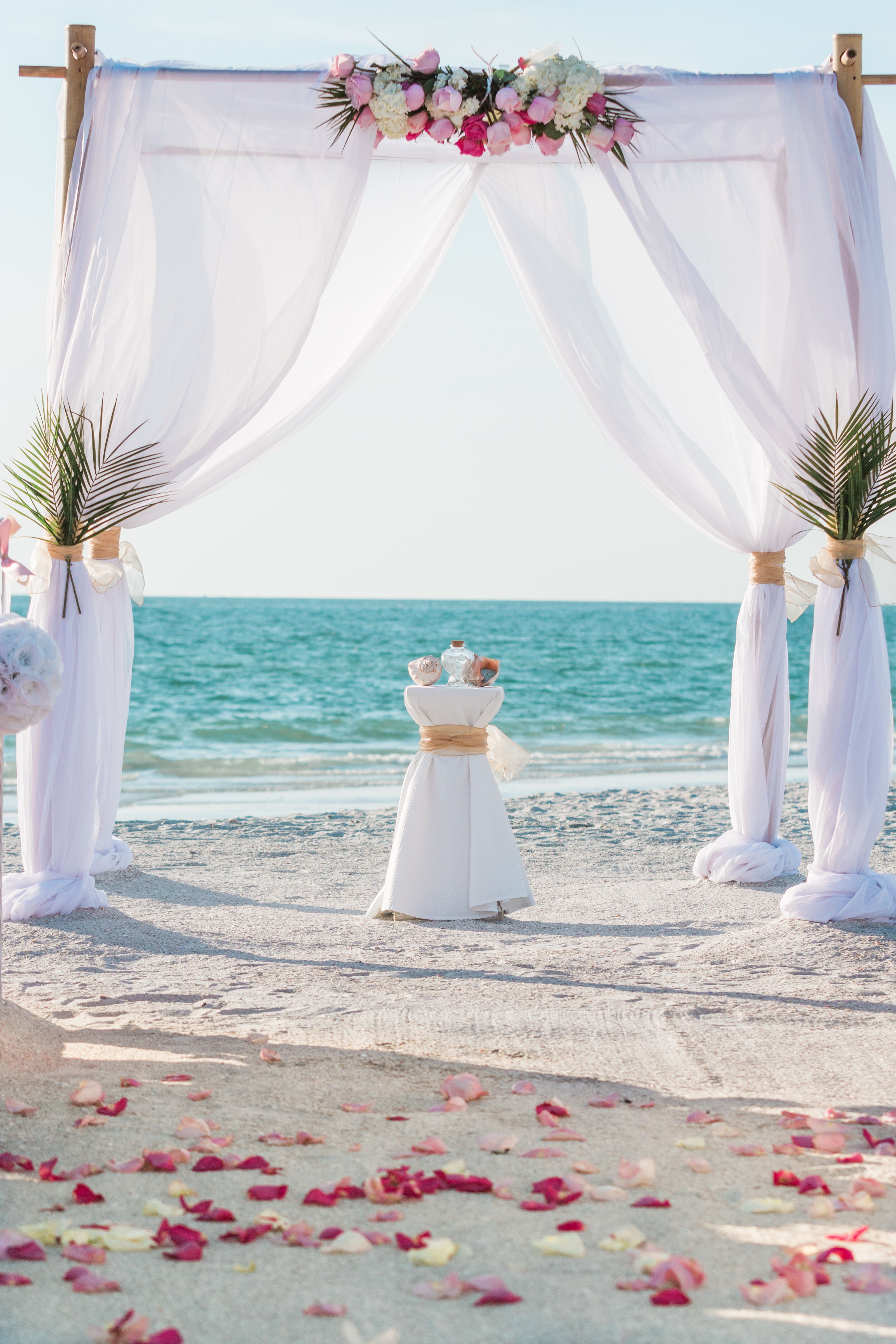 White Wedding Arbor With Palm Fronds