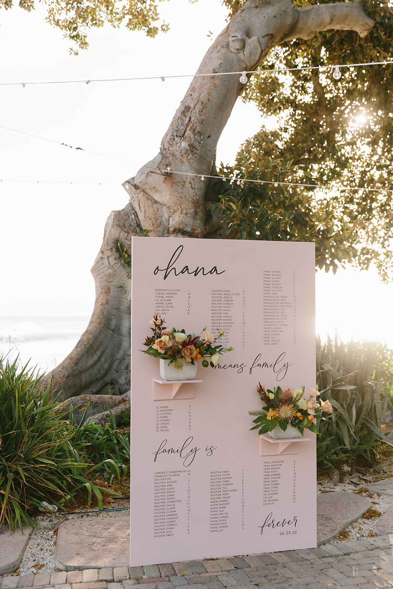 Light Pink Seating Chart With Hawaiian Phrase, Tropical Flowers on Beach