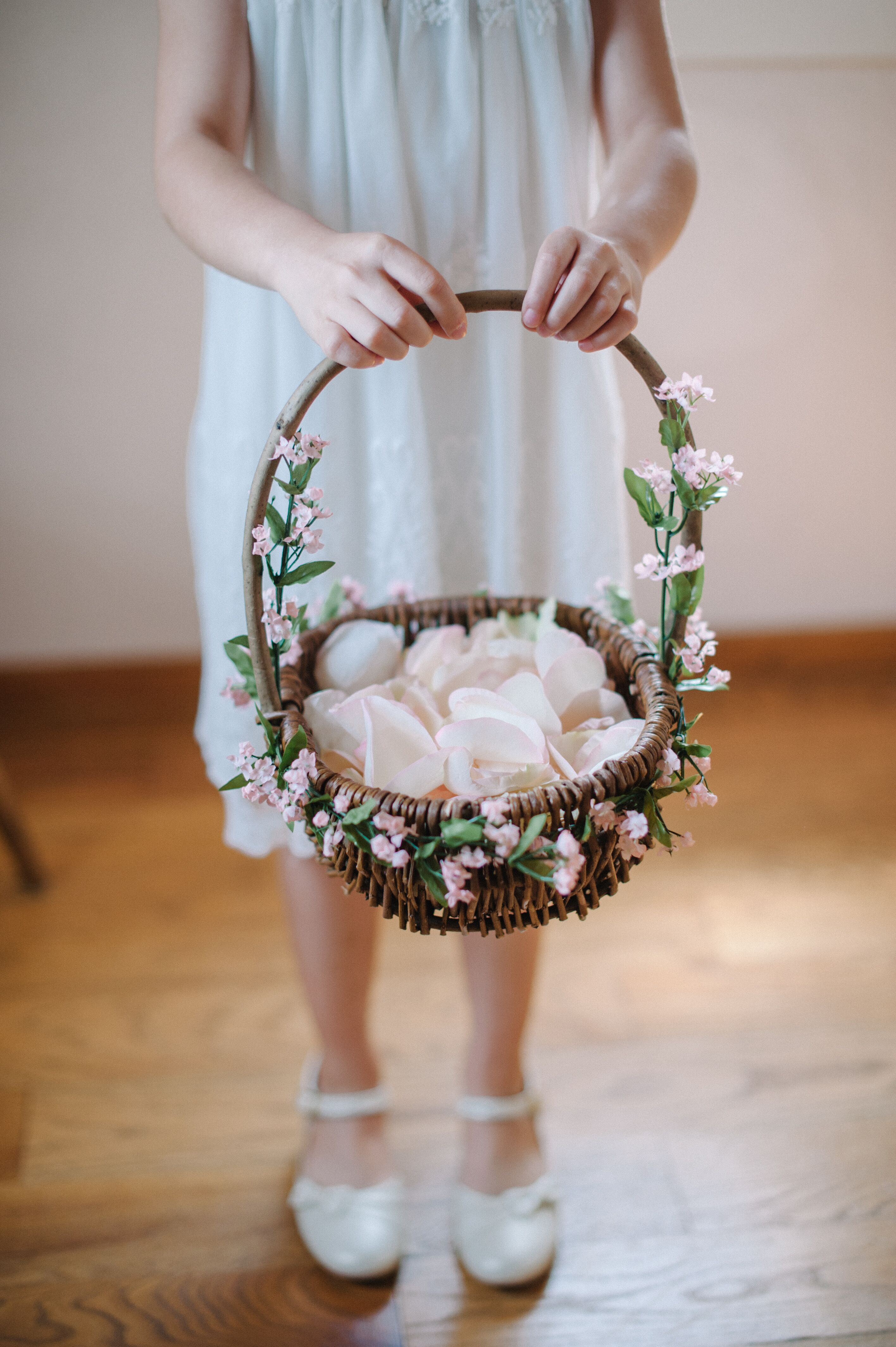 Girl with a cheap basket of flowers