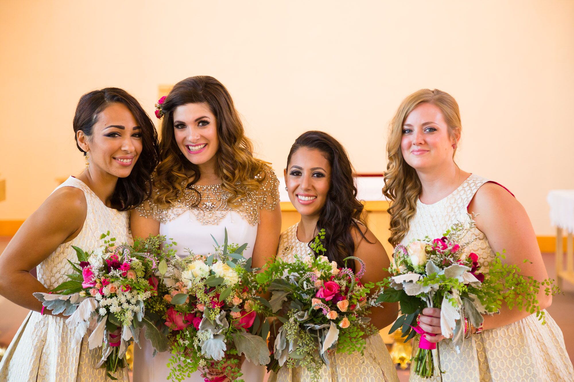 Bride with Bridesmaids Holding Colorful Bouquet